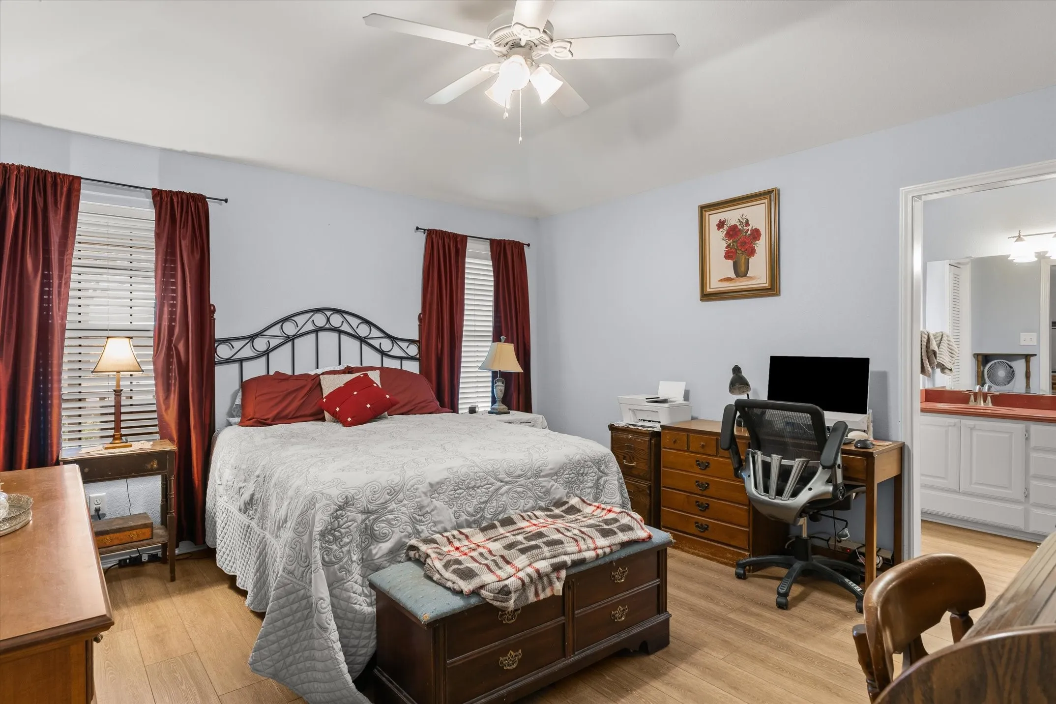 Light blue painted walls with wood-finish flooring