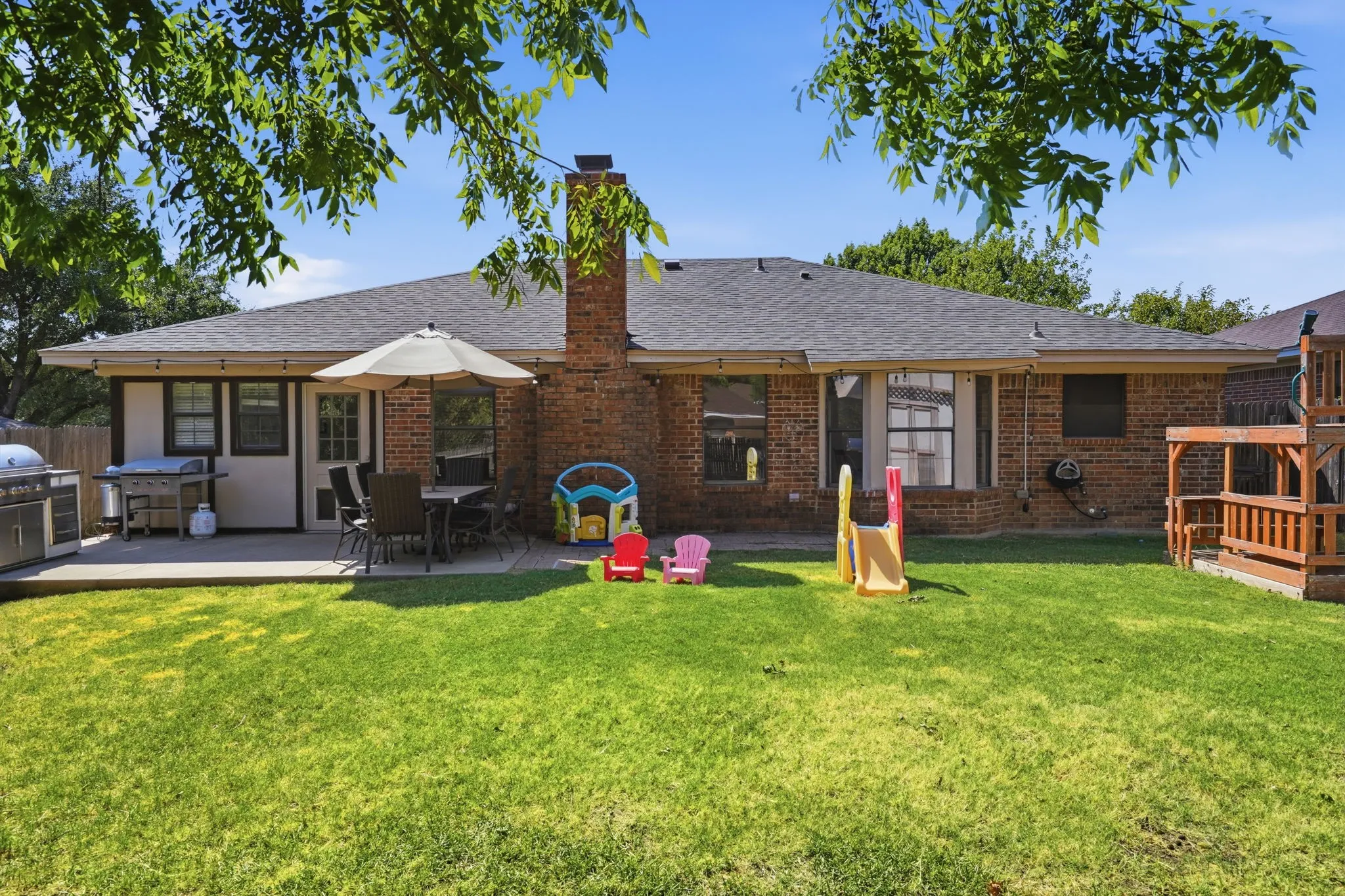 Enjoy the outdoors under the shade of this mature tree, large patio for BBQs