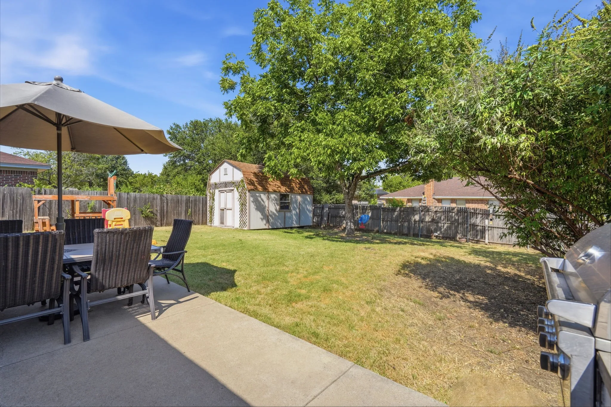 Enjoy the outdoors under the shade of this mature tree, large patio for BBQs