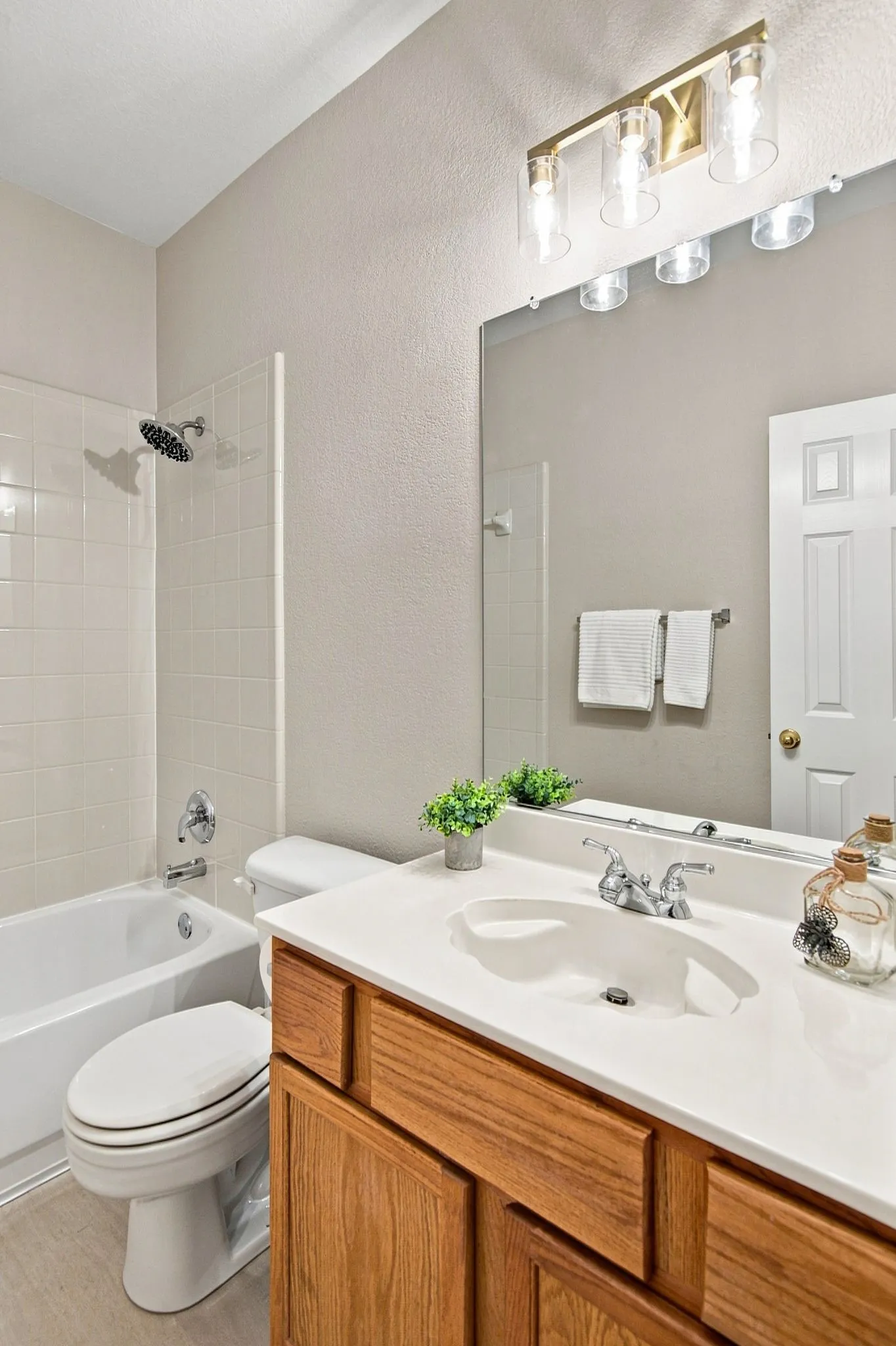 Wood-finish vanity with an integrated sink and spacious countertop