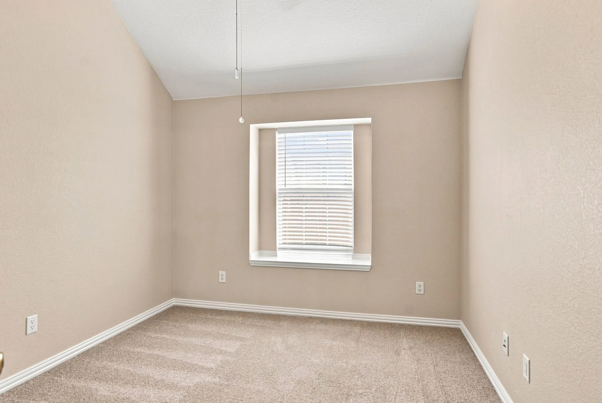 Carpeted flooring, single window with blinds, light-colored walls, white trim, ceiling fan