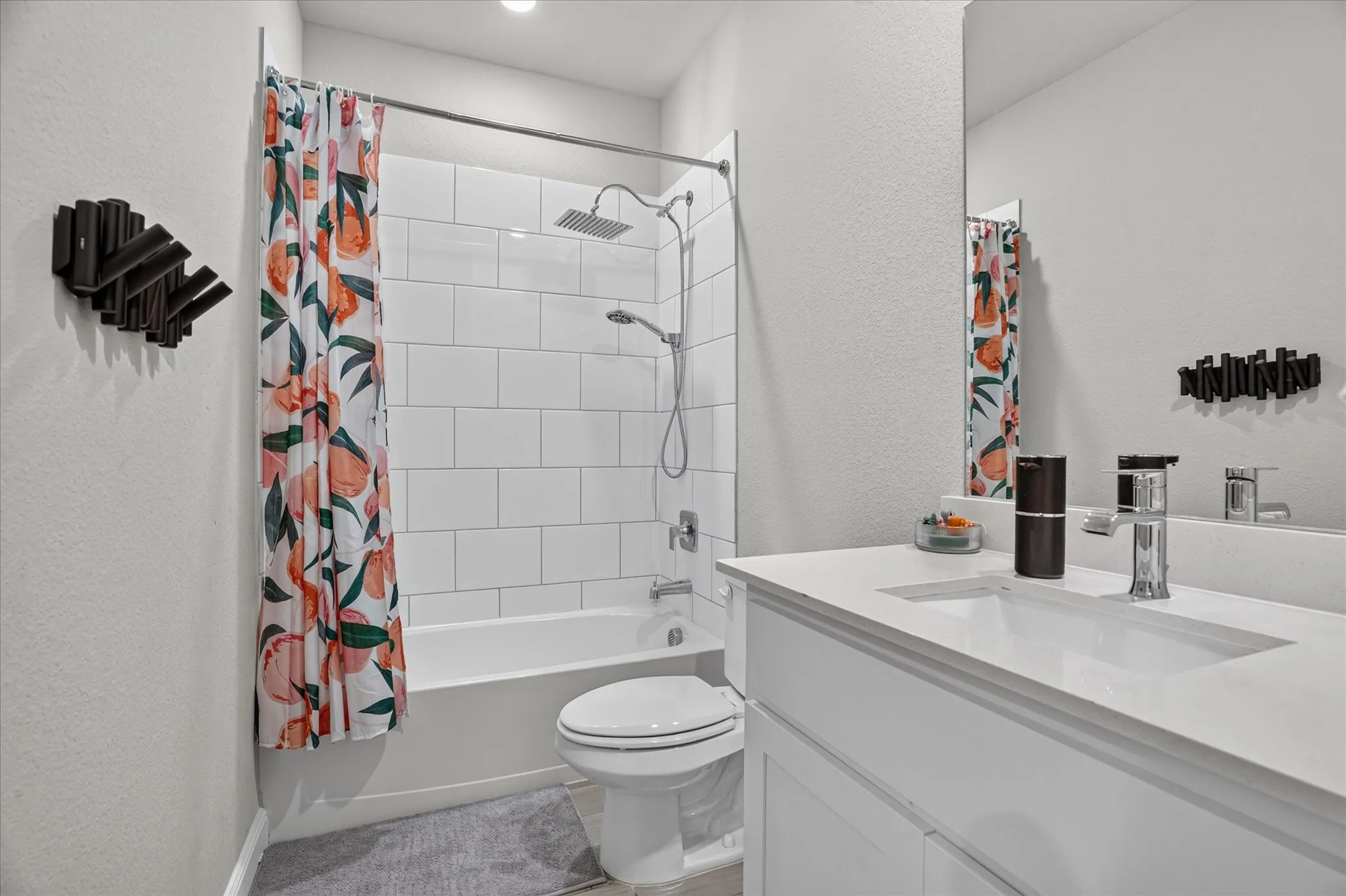 White vanity with an integrated rectangular sink and polished chrome faucet