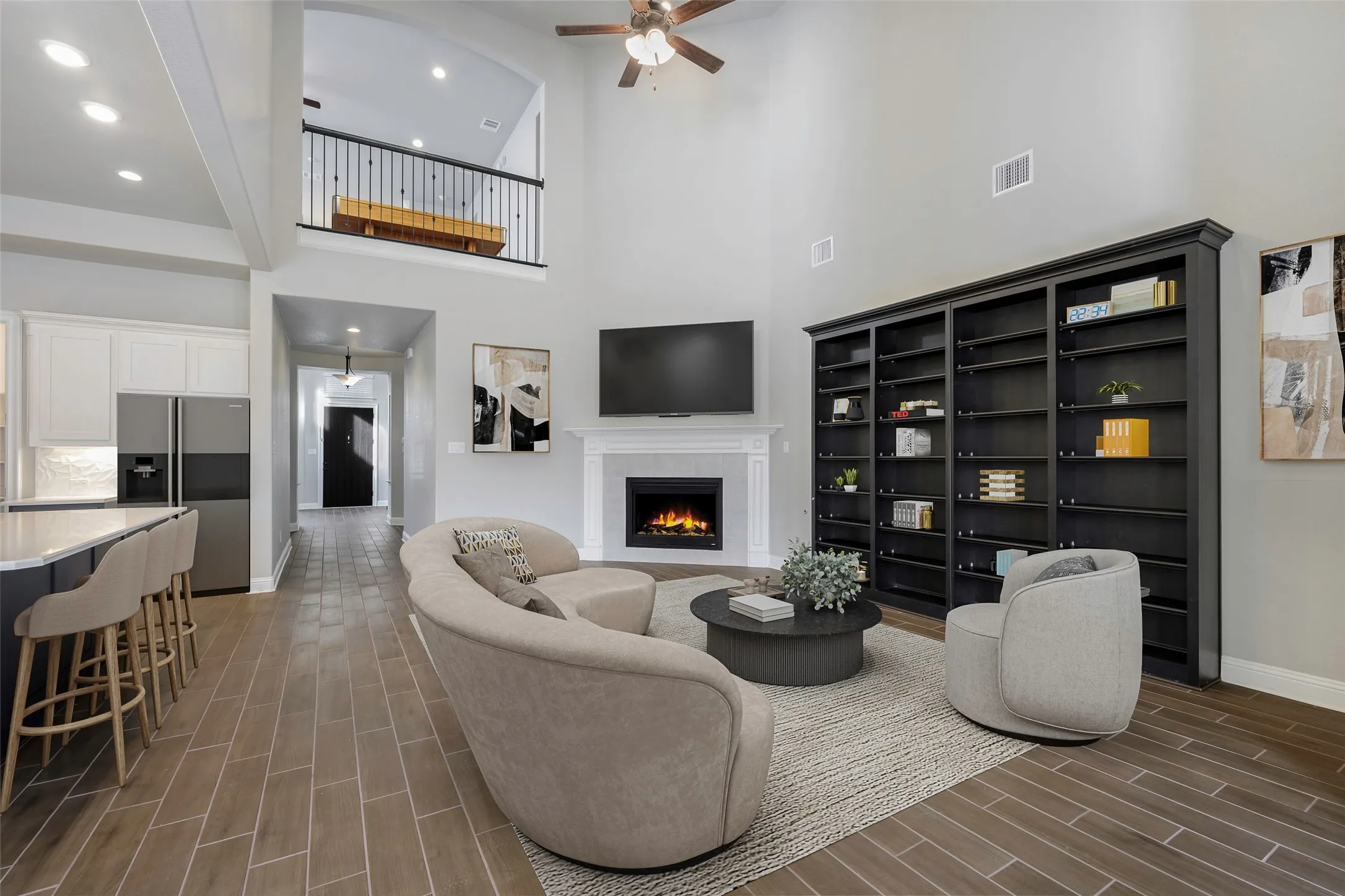 Vaulted ceilings, wood-finish tile flooring, and an integrated fireplace