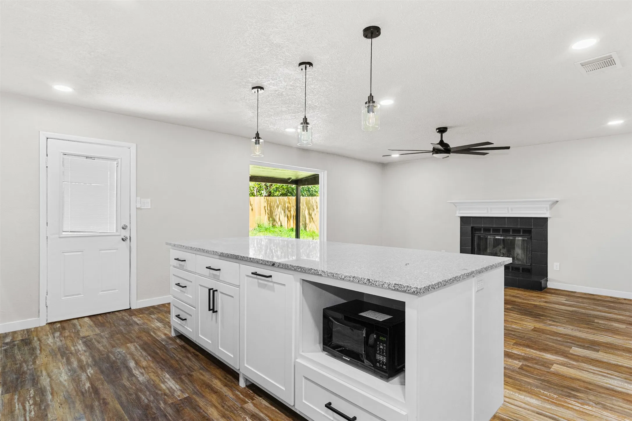 Large new island with granite counters.