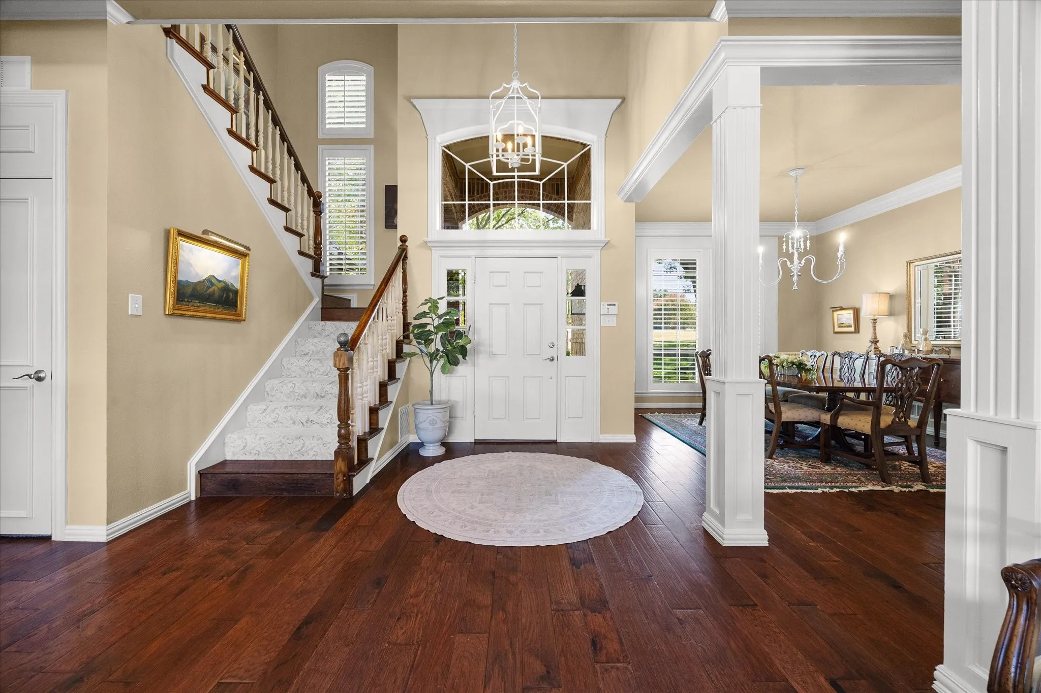 Entry includes impressive staircase and opens onto dining and living areas