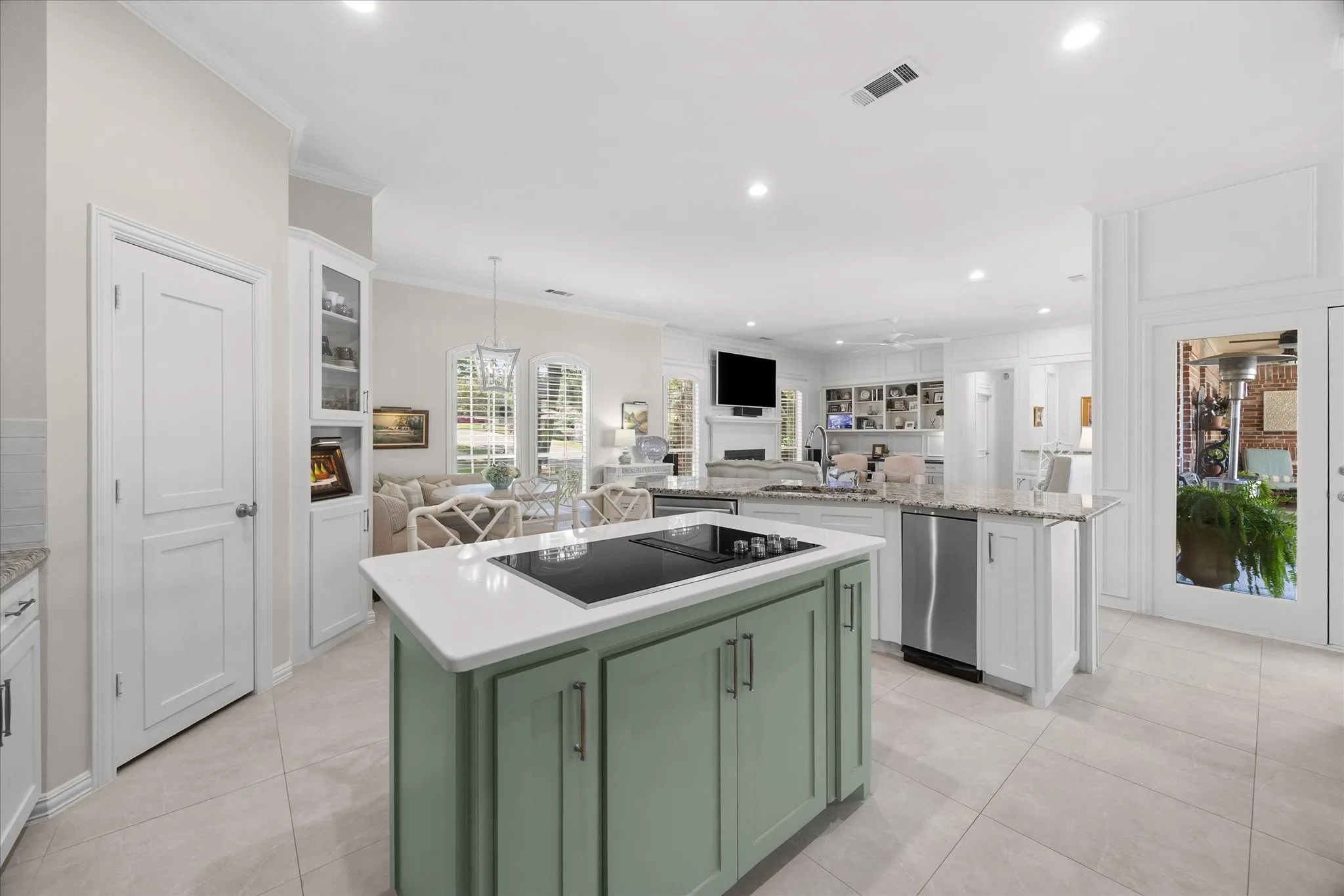 Open floor plan features kitchen opening to breakfast area and family room.