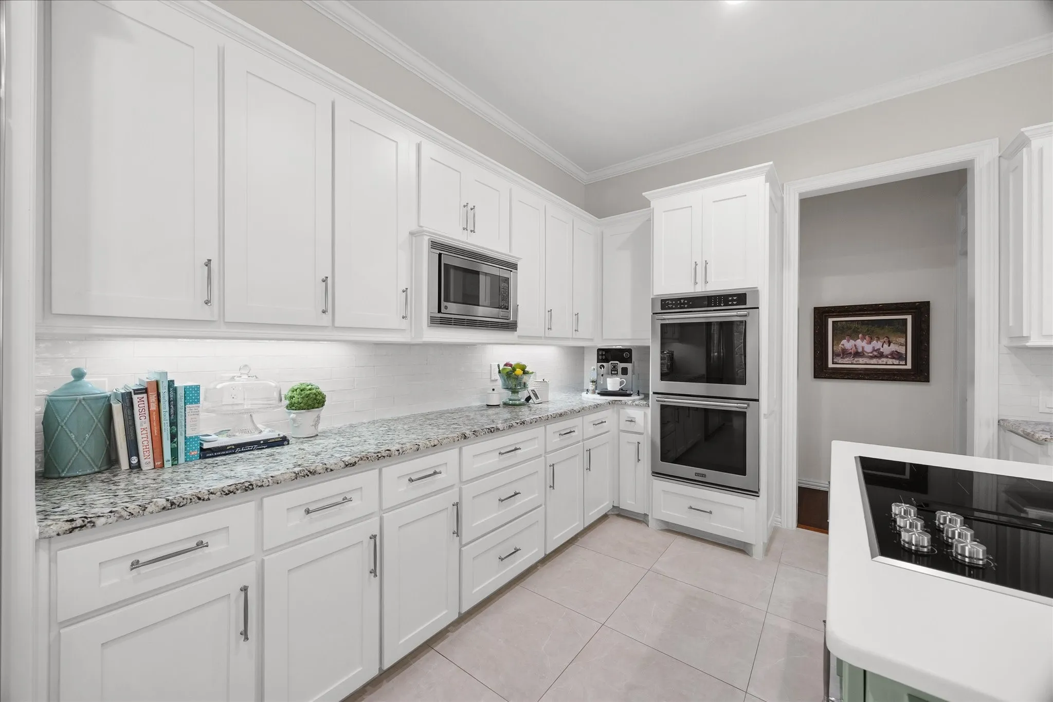 Tons of custom cabinetry and granite counter tops are only a few of this kitchen's many amenities!