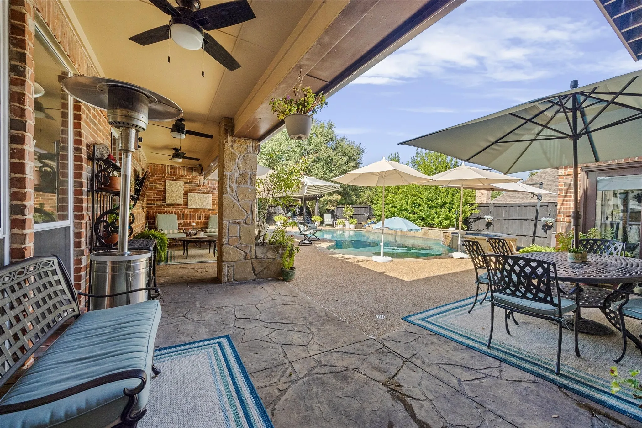 Incredible outdoor living areas overlook pool