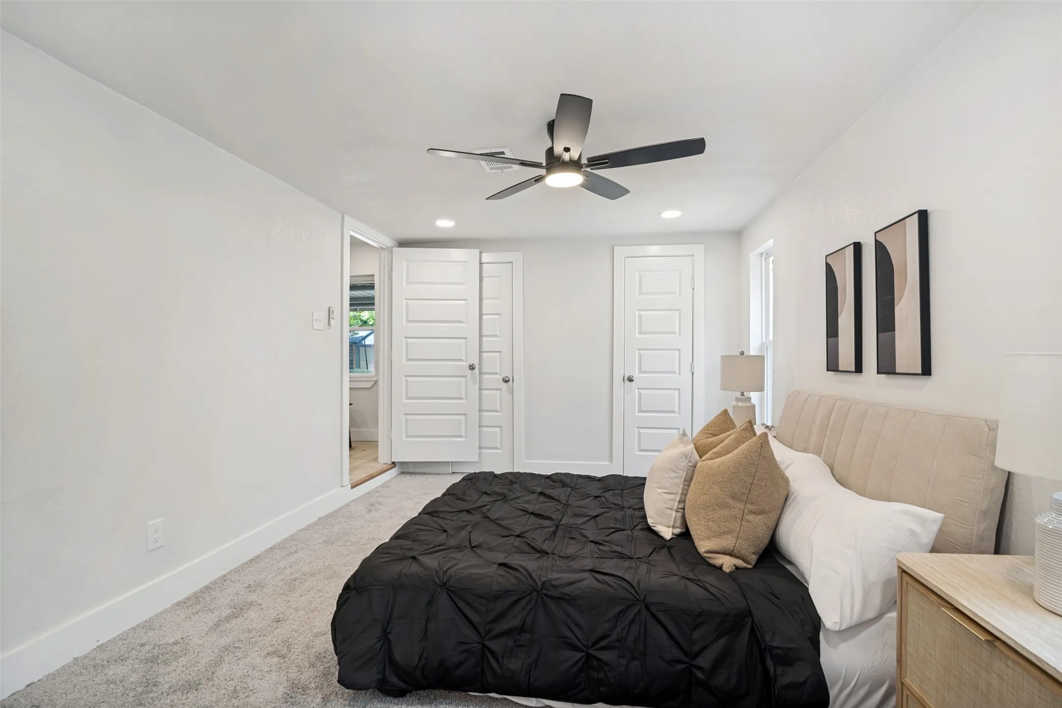 Recessed lighting, ceiling fan with light fixture, carpet flooring, and white paneled doors