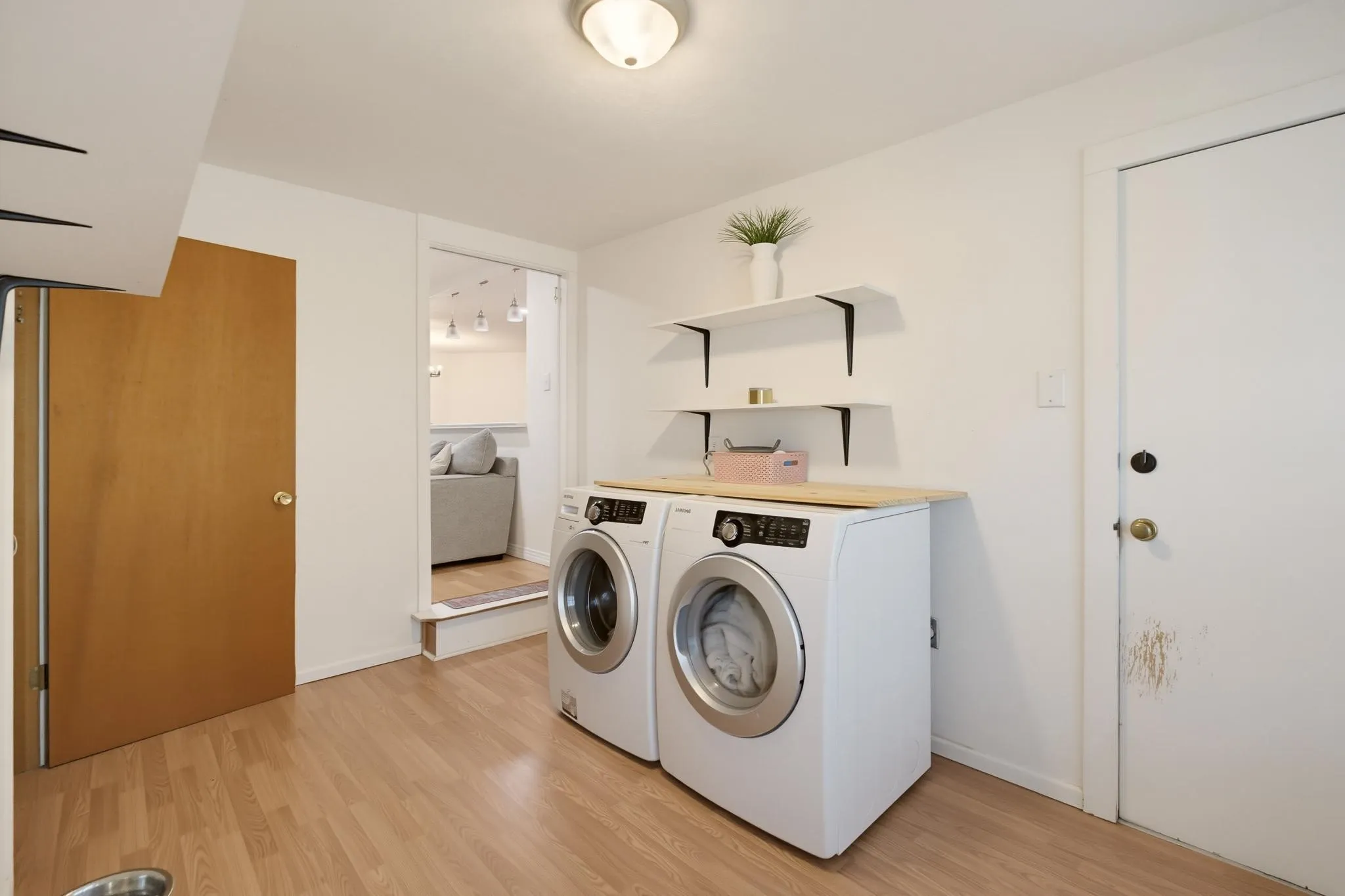 Utility area which leads to the basement.