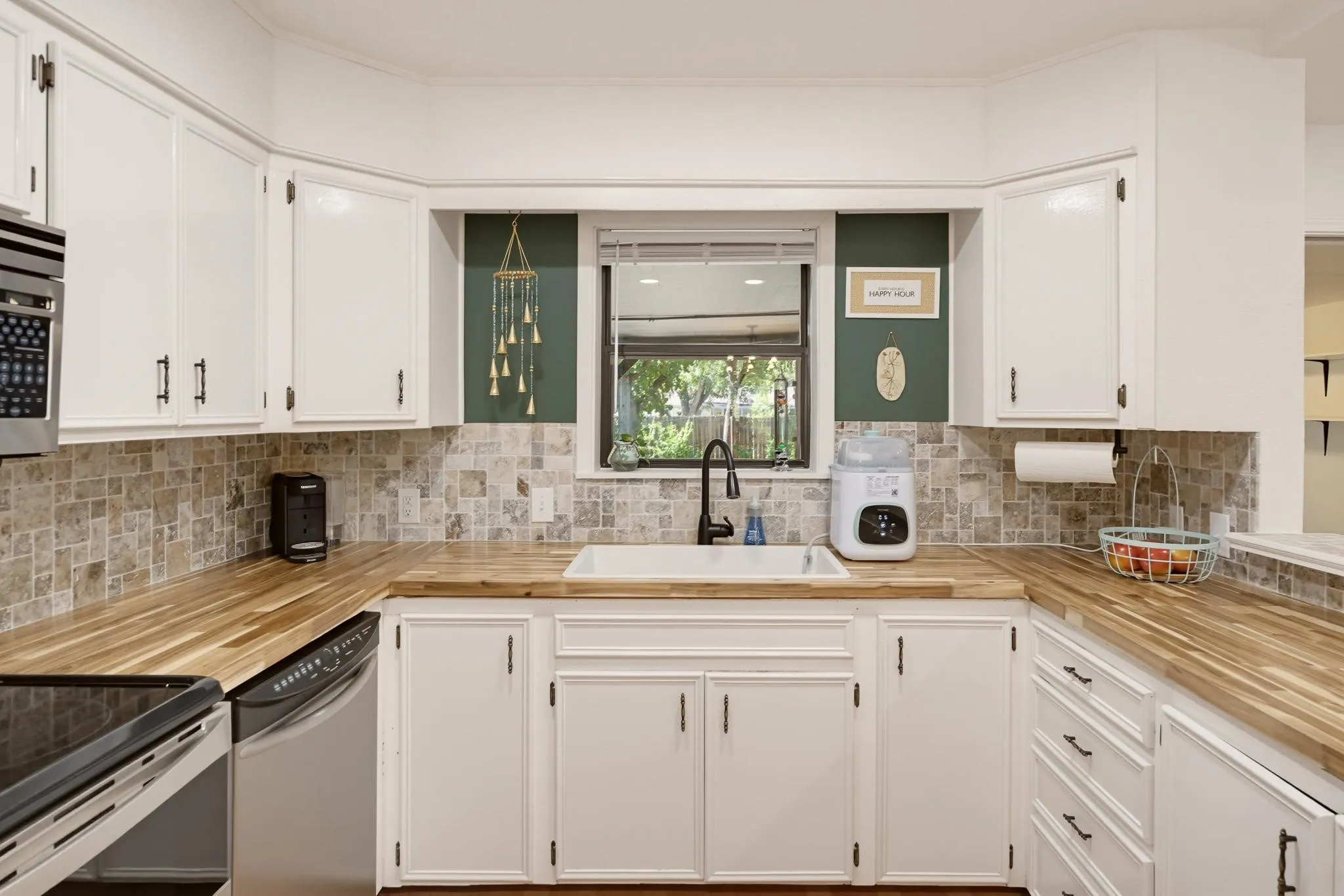 Nice view of the backyard with window above the sink