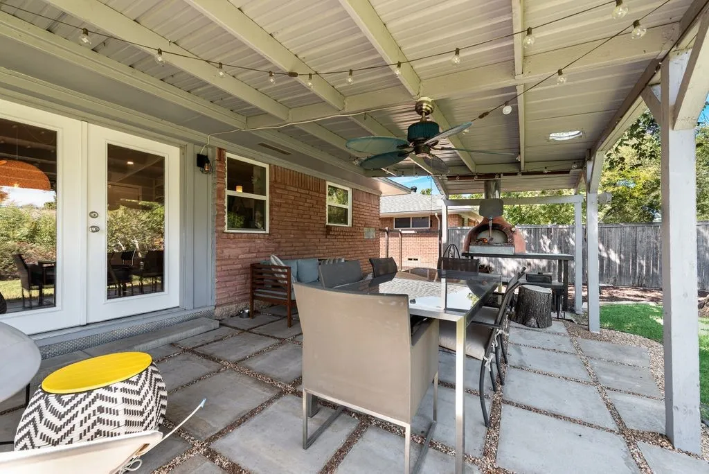 Covered patio features a wood-fired pizza oven.  Imagine the parties you can host!