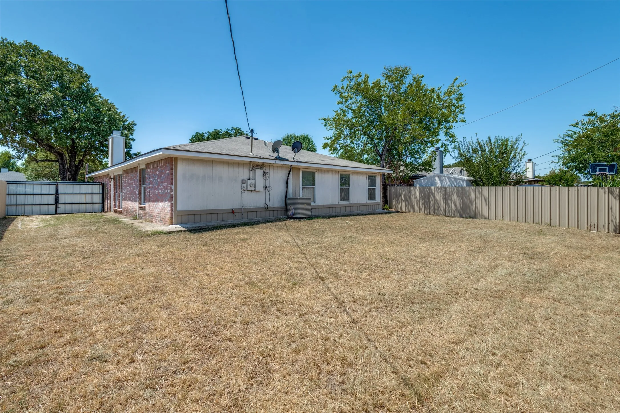 Expansive backyard space with a full perimeter fence