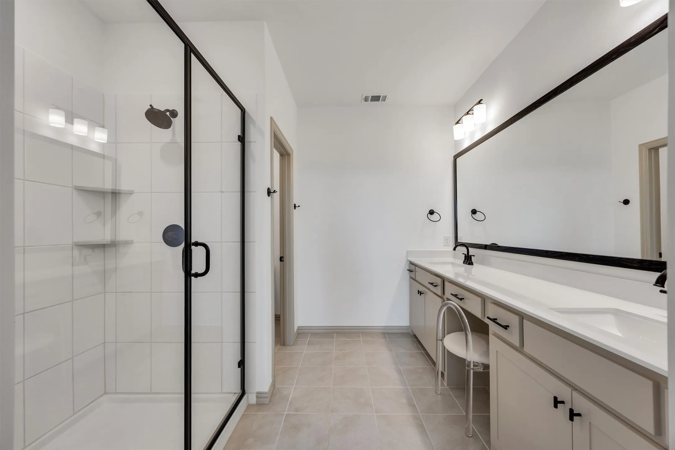 Primary ensuite bathroom with large shower