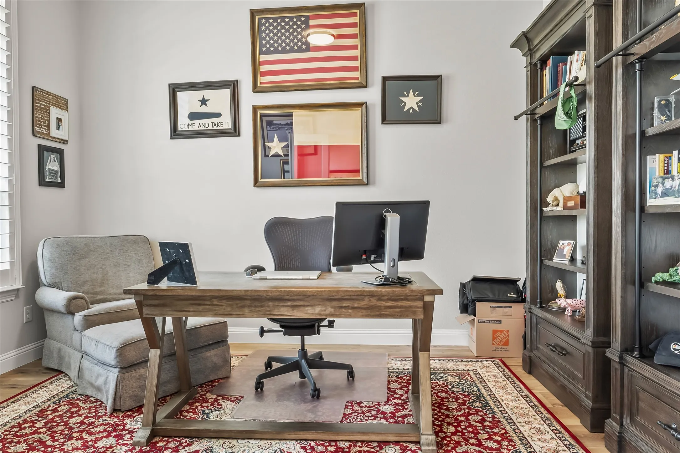 Office with hardwood / wood-style floors