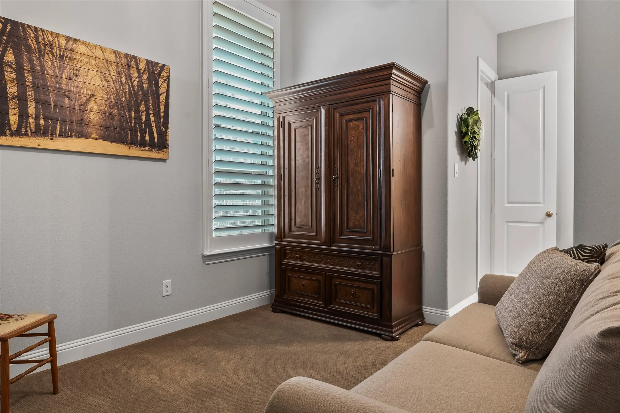 Living area featuring carpet flooring and plenty of natural light