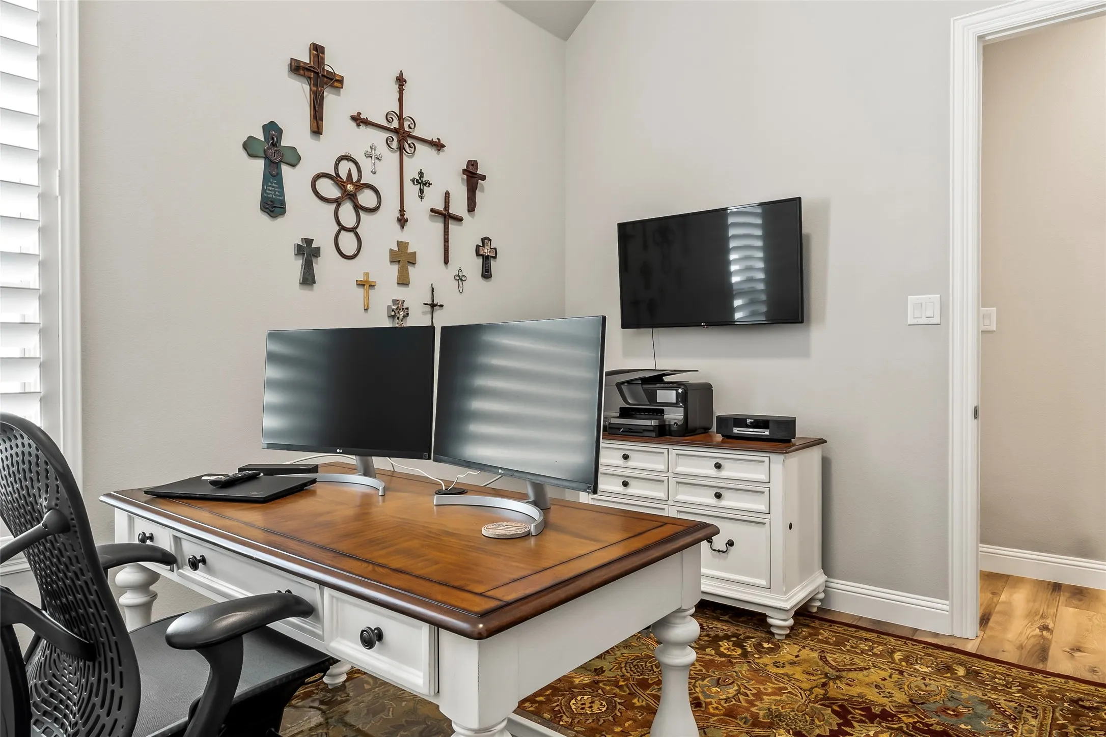 Home office with dark wood-type flooring