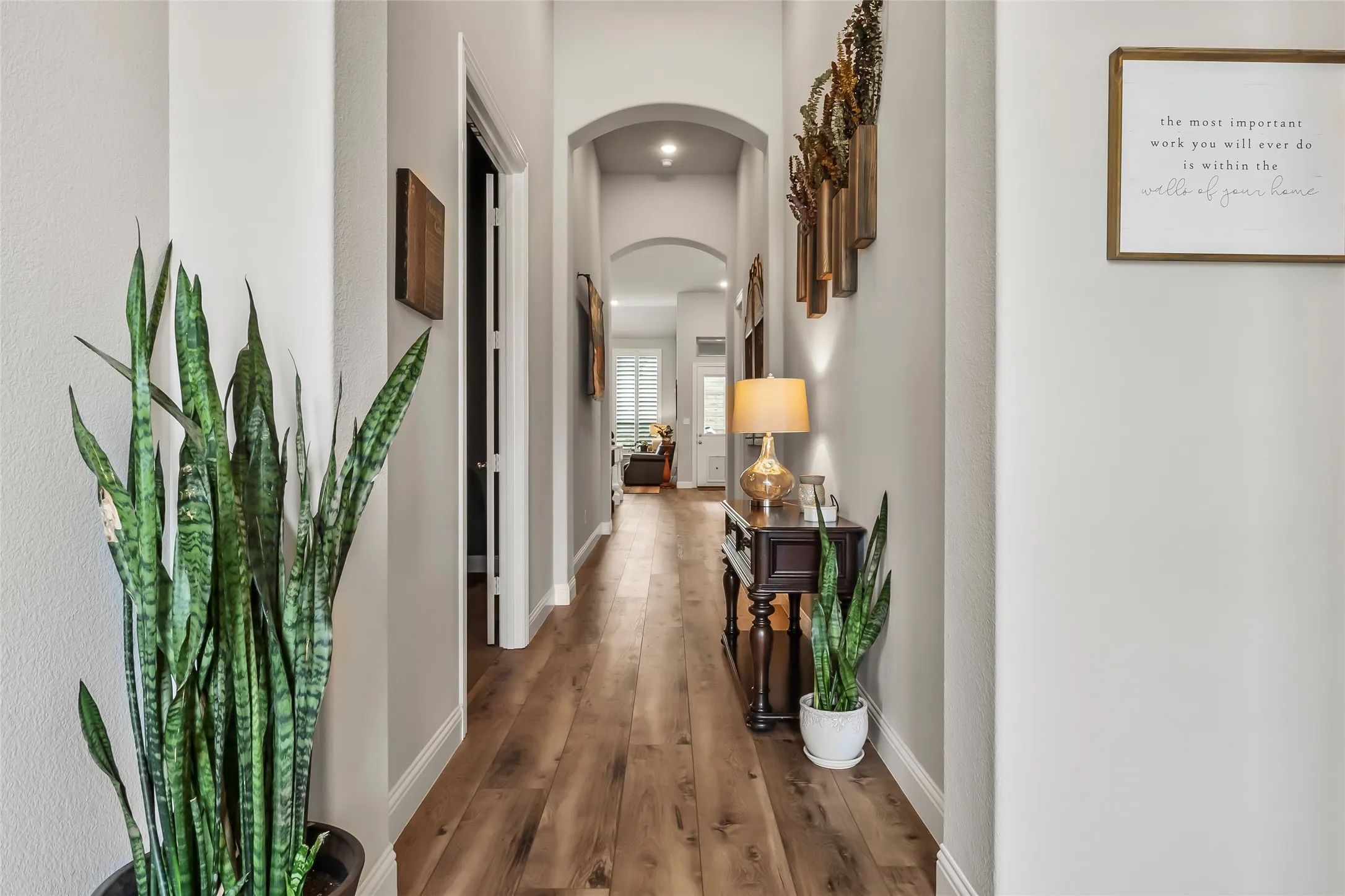 Hall with dark hardwood / wood-style floors