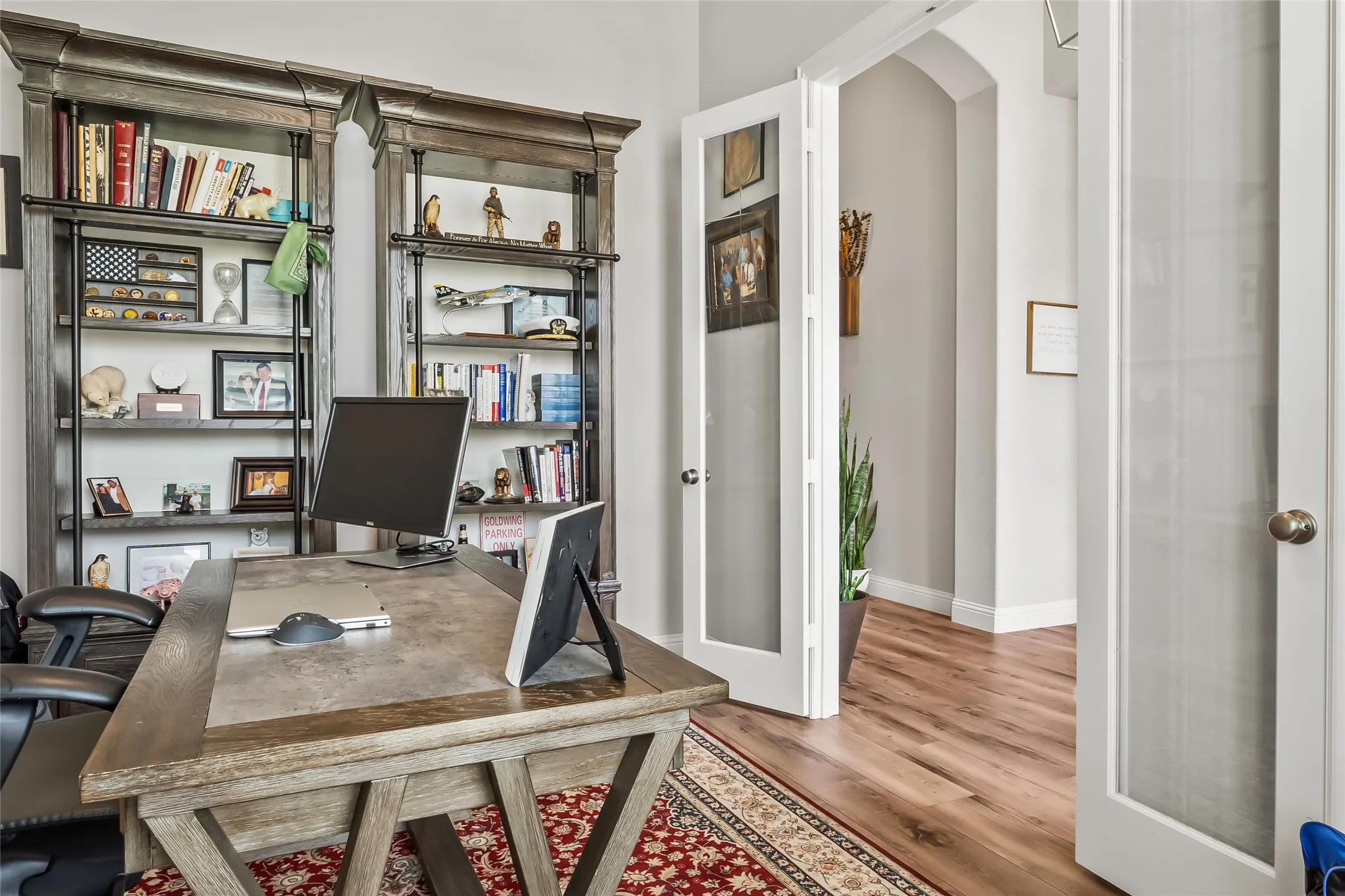 Office area featuring french doors and hardwood / wood-style flooring