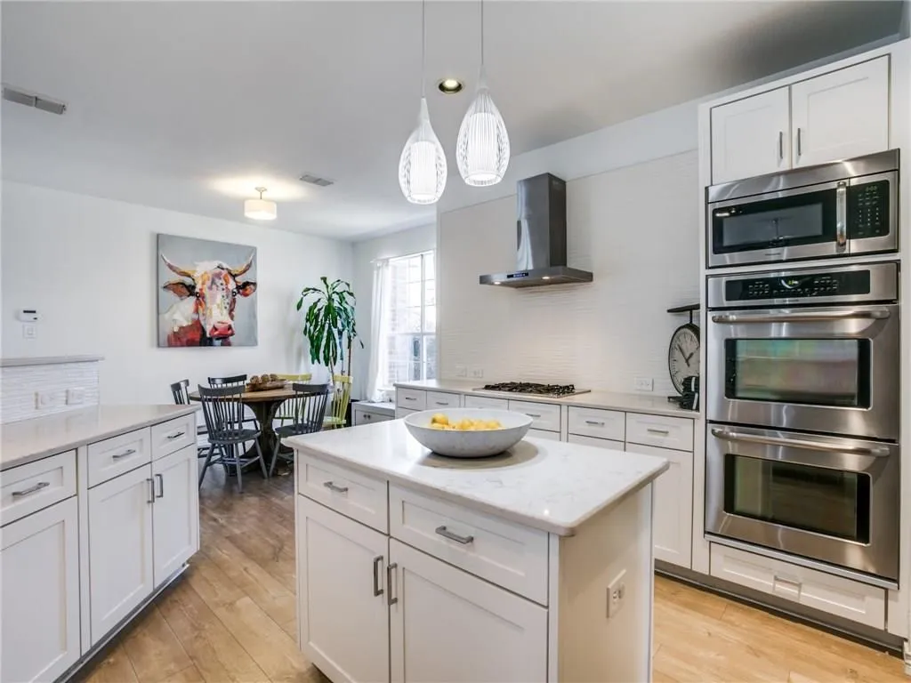 Island Kitchen Features SS Appliances And Superb Storage.