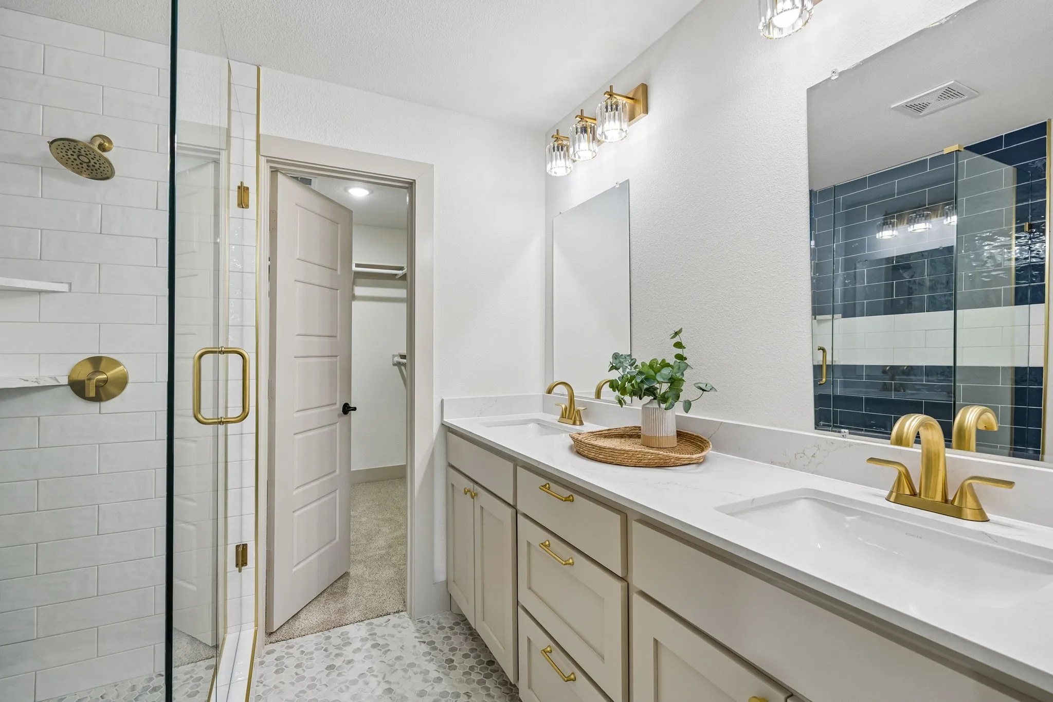 Dual vanity with undermount sinks and light-toned cabinetry