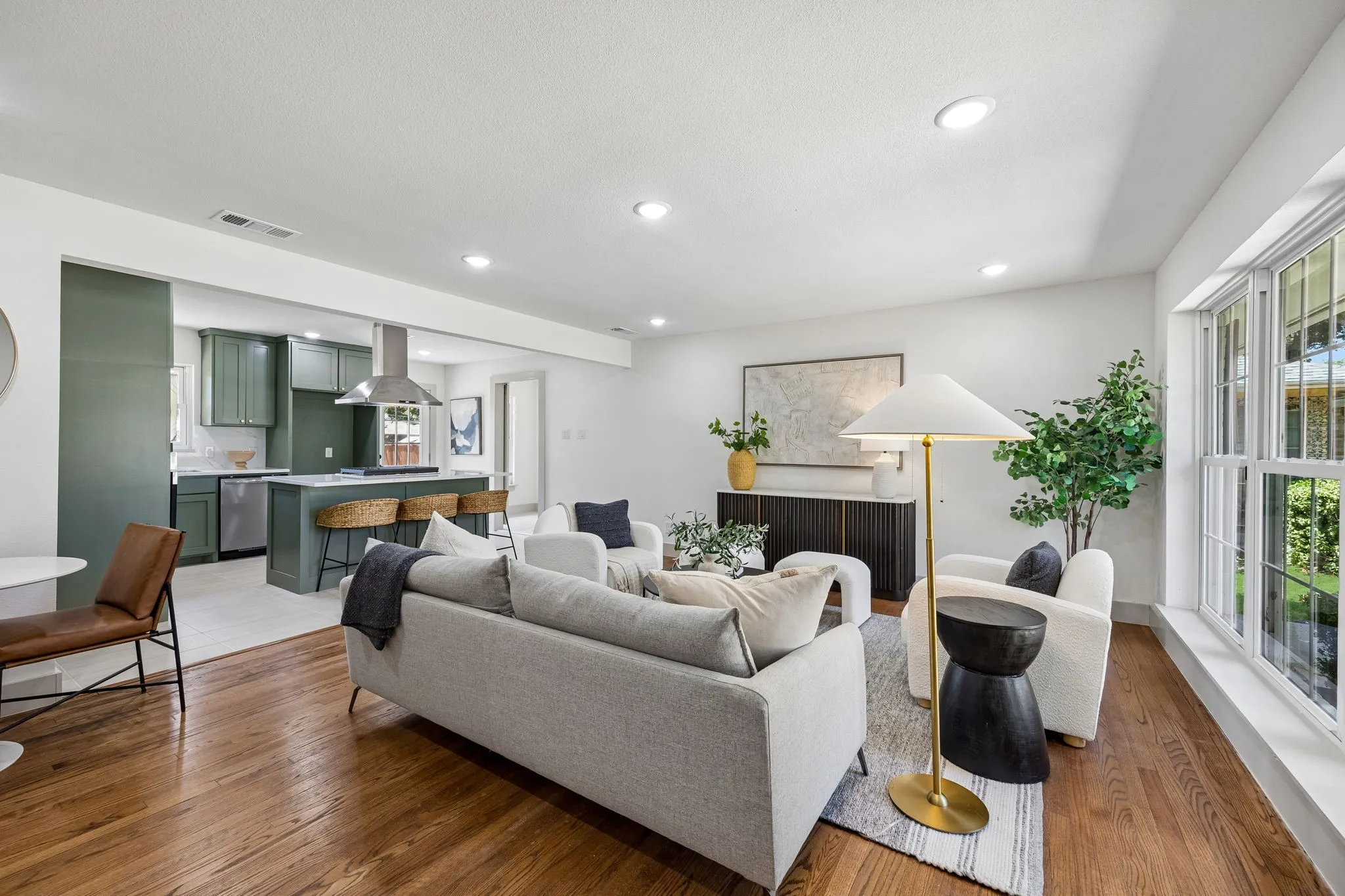 Open-concept living space with wood-finish flooring