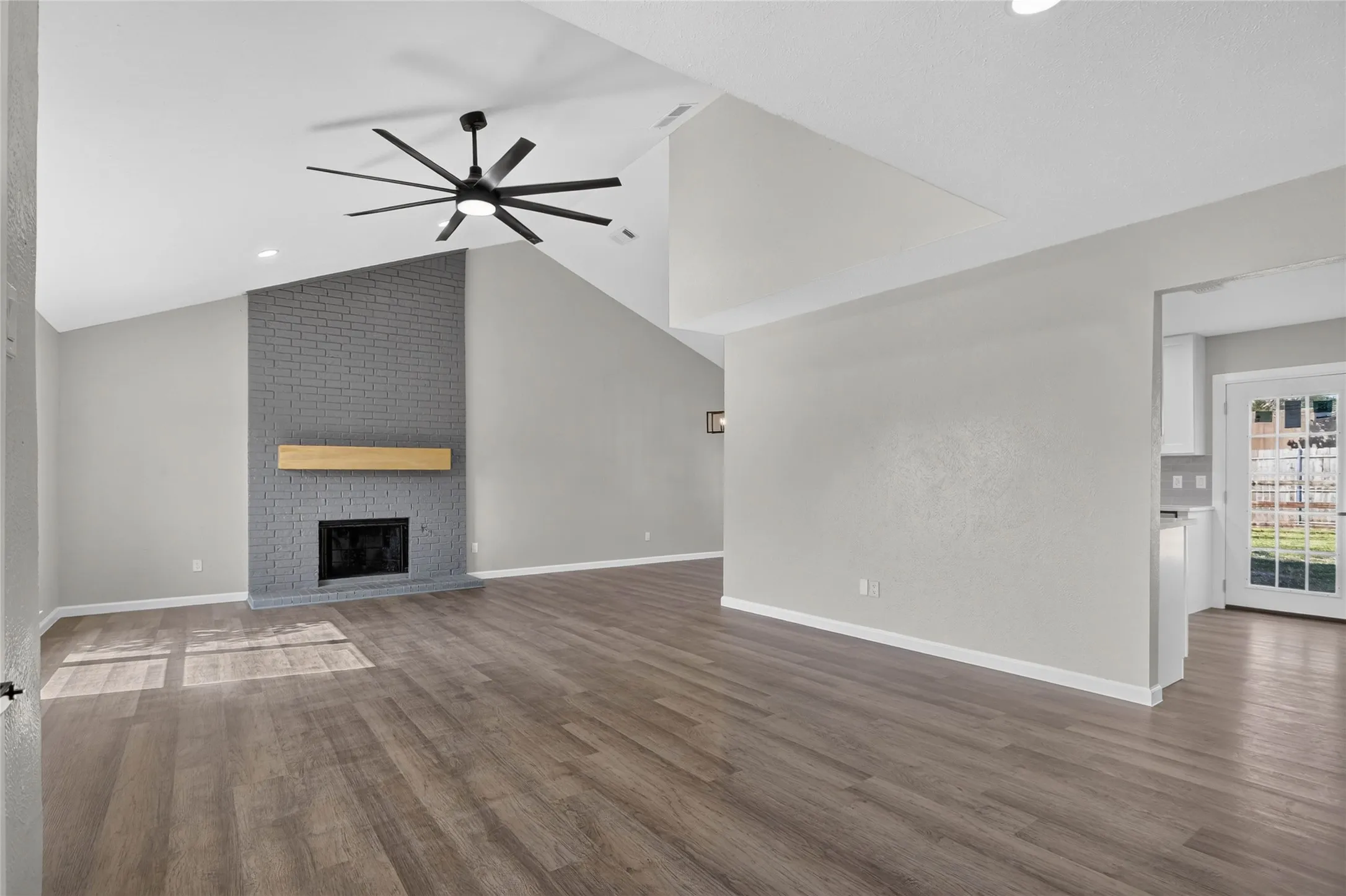 Vaulted ceilings and wood-finish flooring
