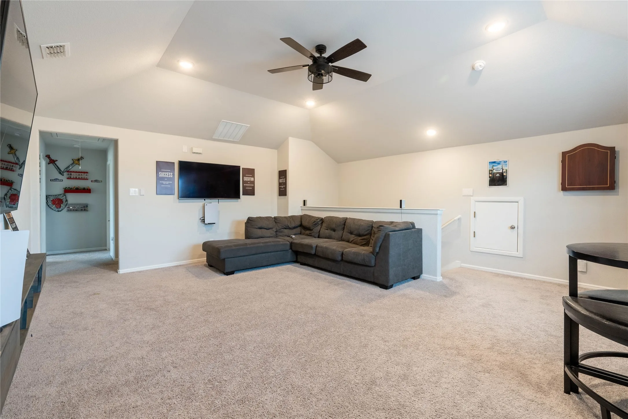 Carpeted bonus room featuring a sloped ceiling, recessed lighting, and a ceiling fan