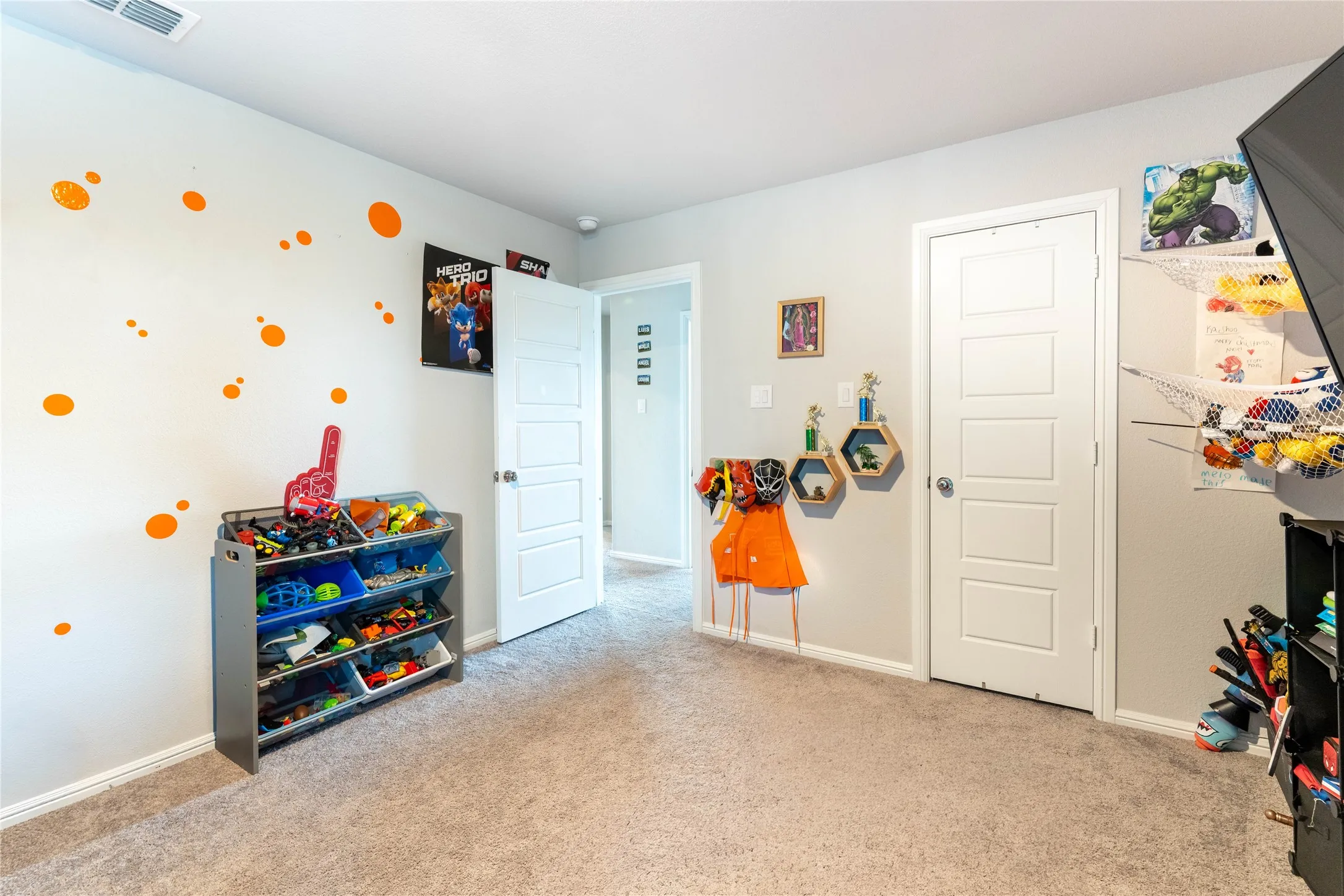 Neutral wall color, carpeted flooring, and white paneled doors