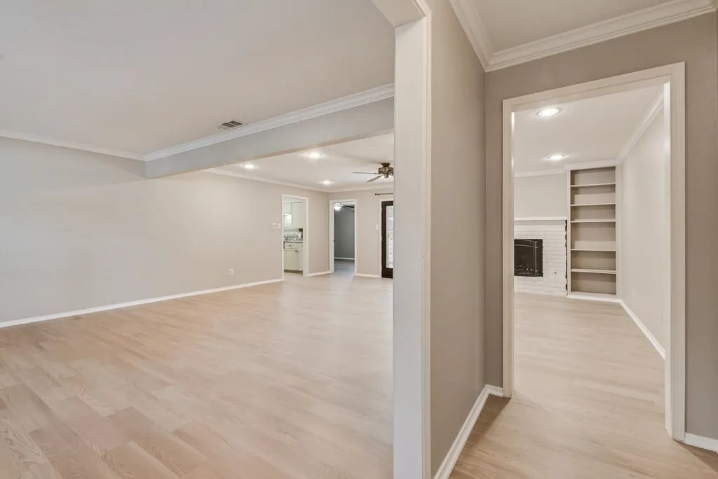 An open, flowing layout connects the home’s two spacious living areas, offering flexibility for entertaining, relaxing or creating separate gathering spaces. Built-in shelving and a gas fireplace add character and function to the second living area.