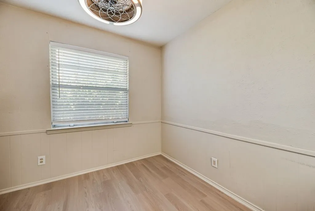 A dedicated dining area just off the kitchen offers a cozy spot for everyday meals, with natural light and room to make the space your own.