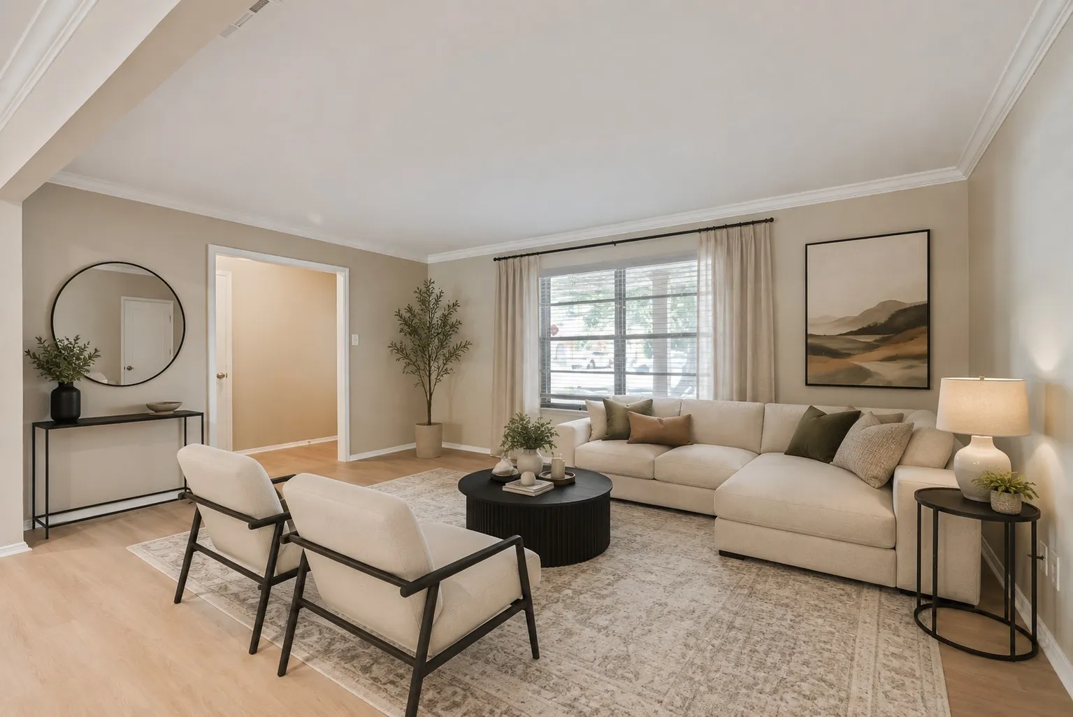 Digitally Staged. Spacious front living area showcases brand-new LVP flooring, fresh neutral paint and abundant natural light. The open layout provides a versatile blank canvas ready to fit your personal style.