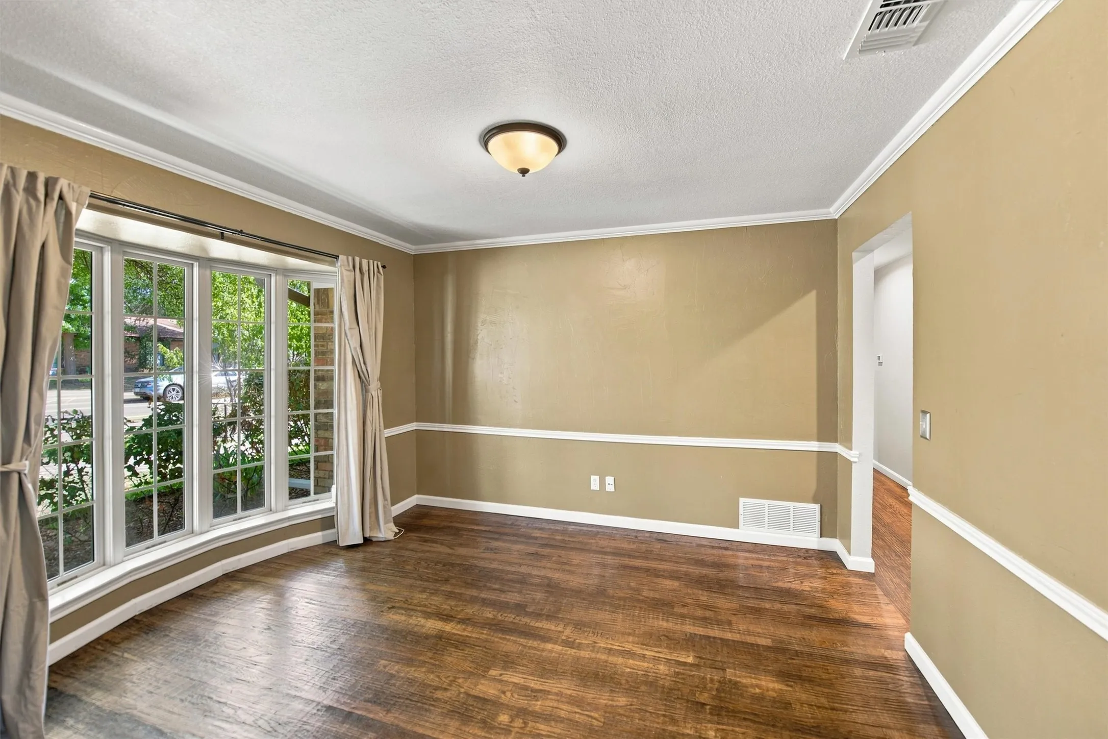 Hand scraped hard wood flooring in the formal dining room.