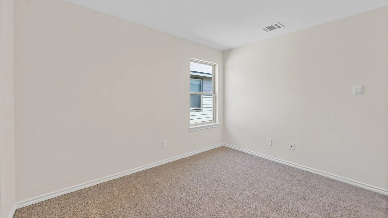 Wall-to-wall carpeting and neutral wall tones