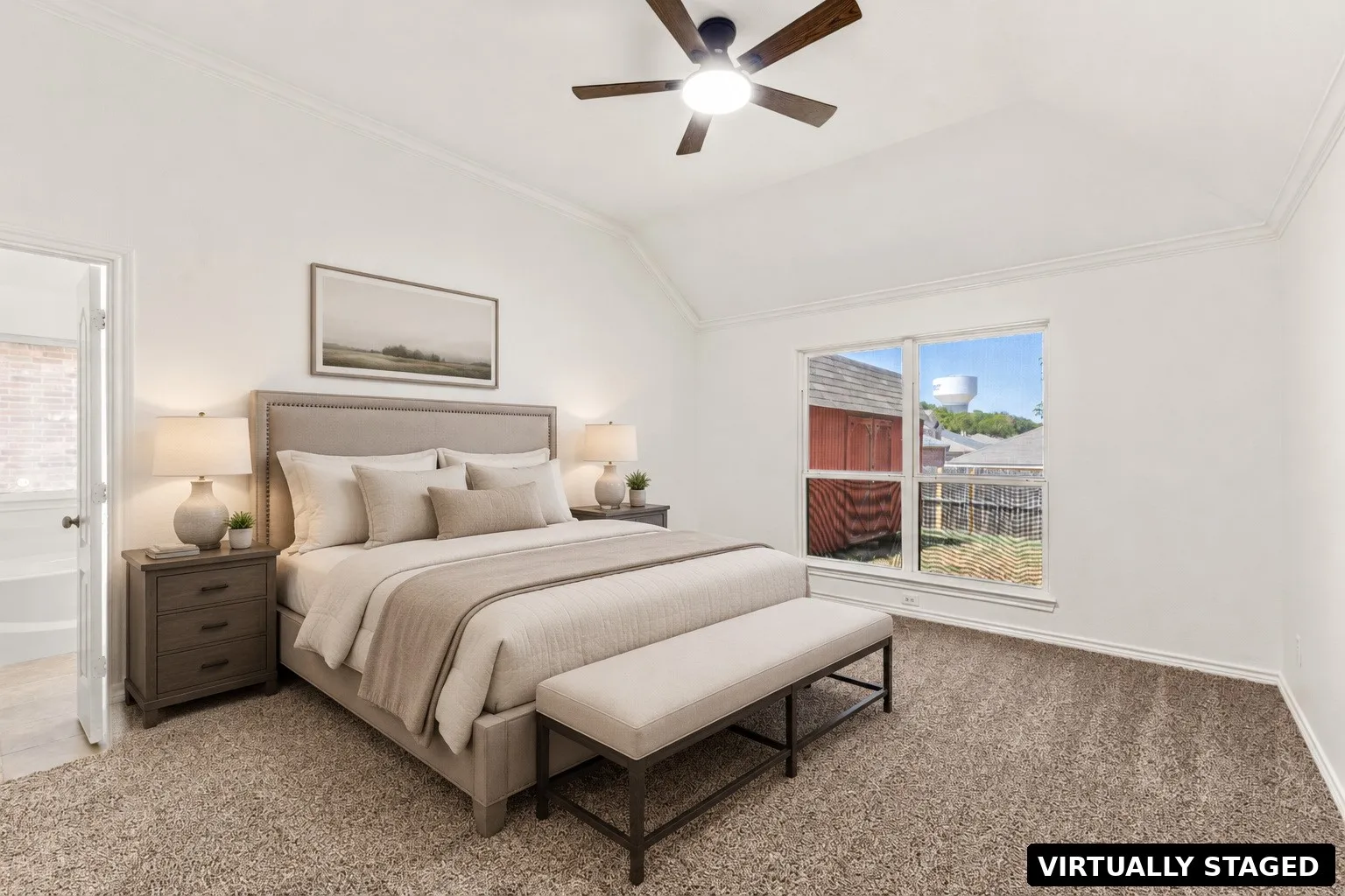 Vaulted ceiling, ceiling fan with integrated lighting, large window, broad crown molding, plush carpeting