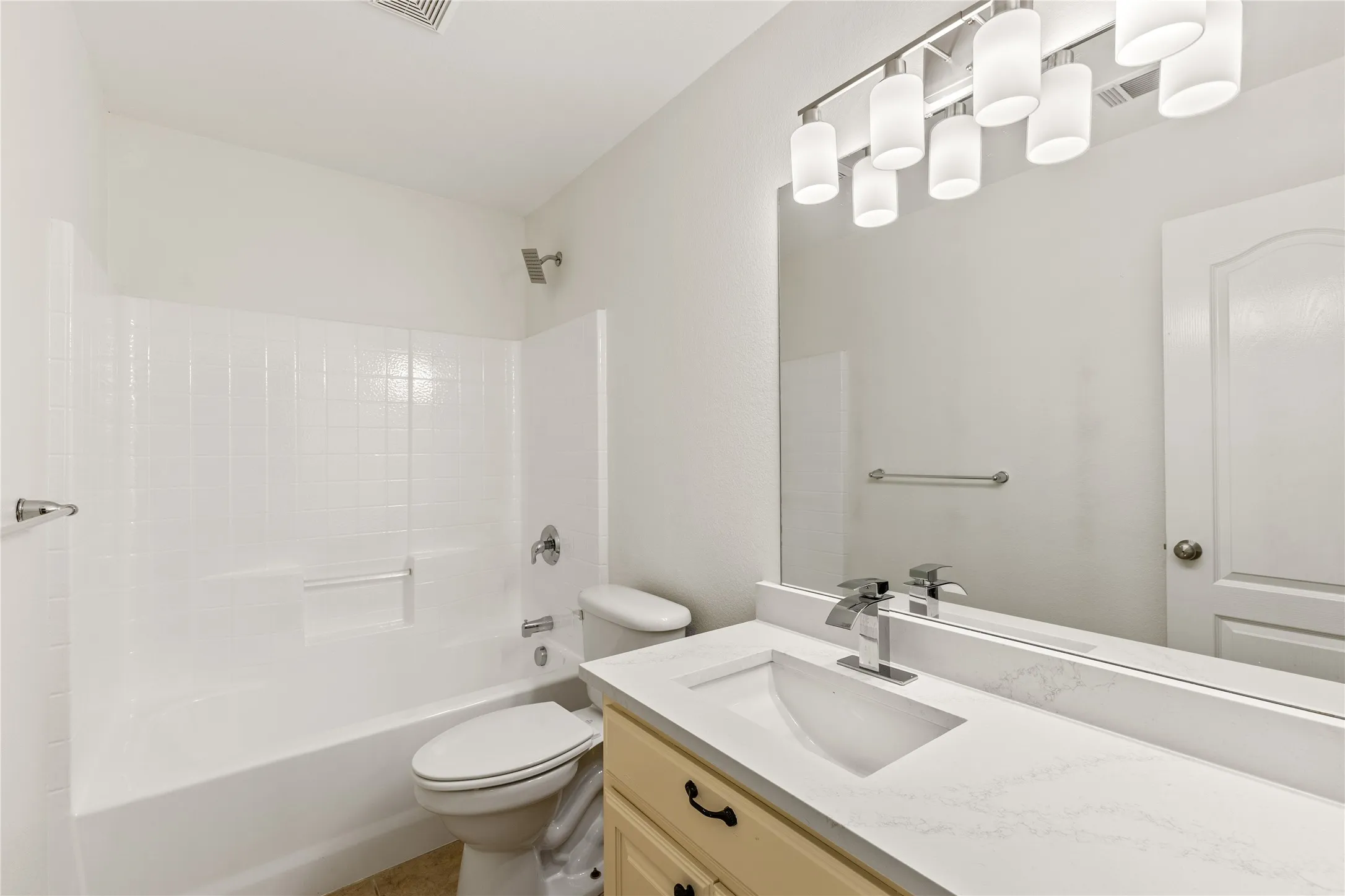 White tile shower with integrated tub