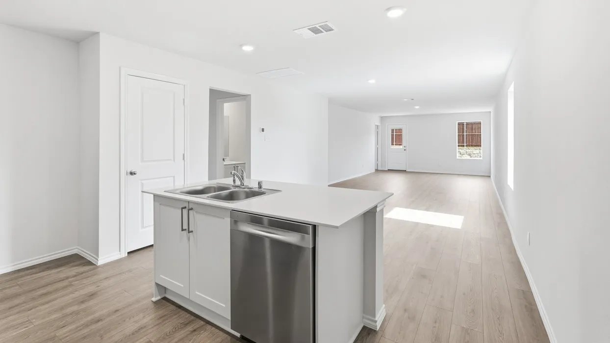 Open-concept living area featuring wood-finish flooring, recessed lighting, and white interior paint
