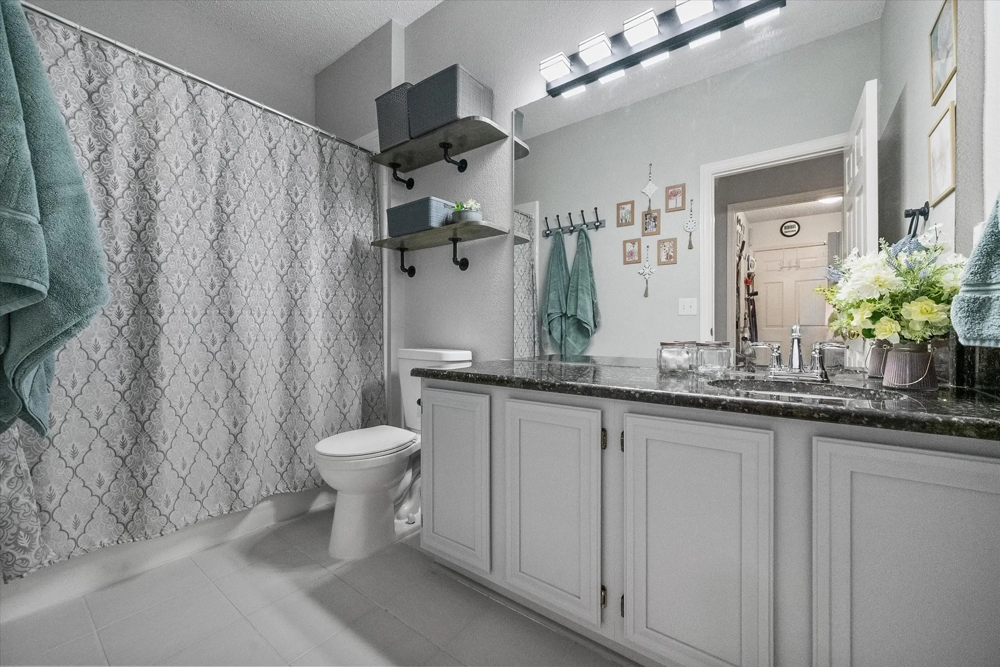 Second bath offers plenty of cabinet space and neutral finishes!