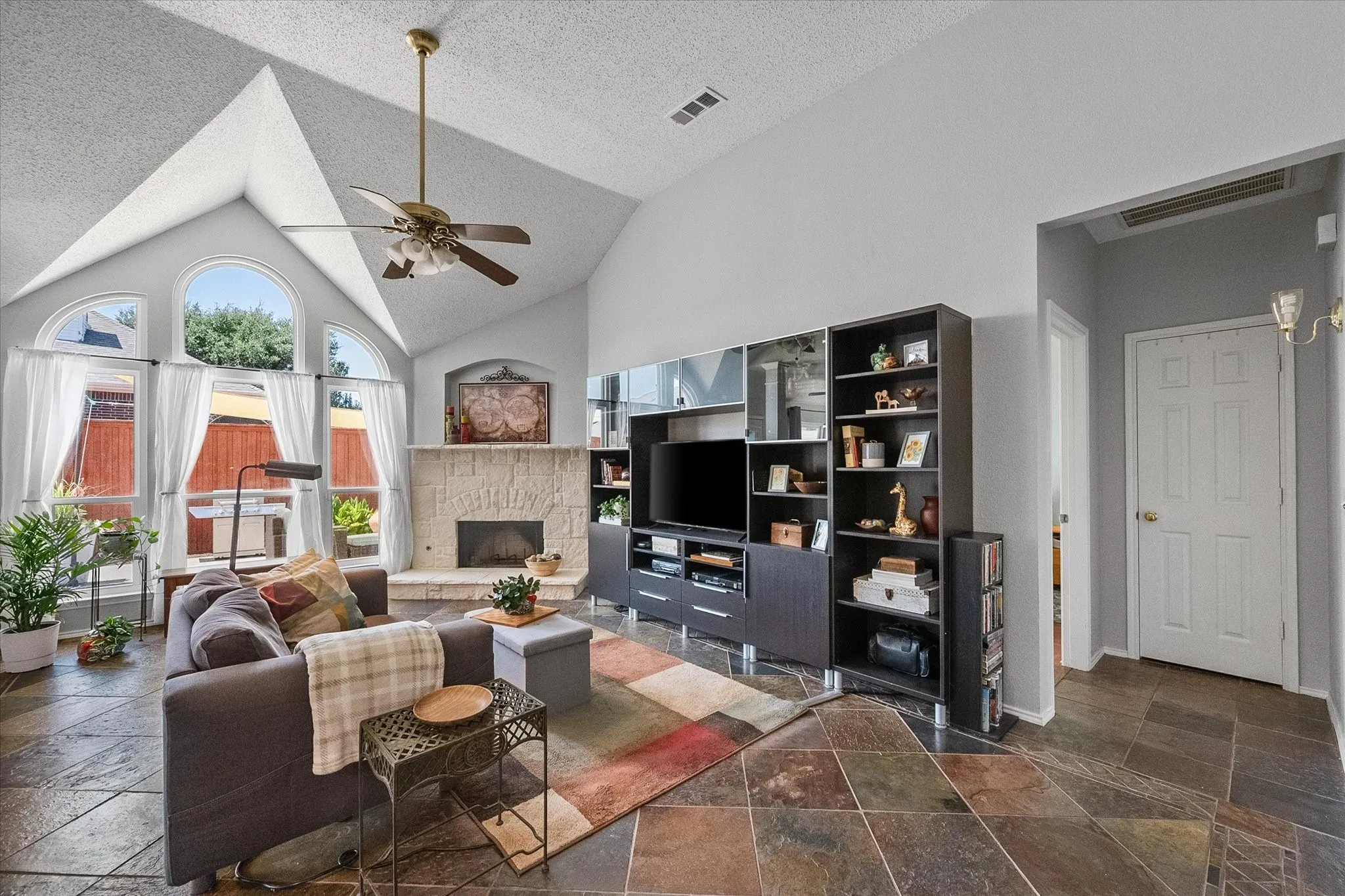 Vaulted ceilings add to the airy and open feel of the living room.
