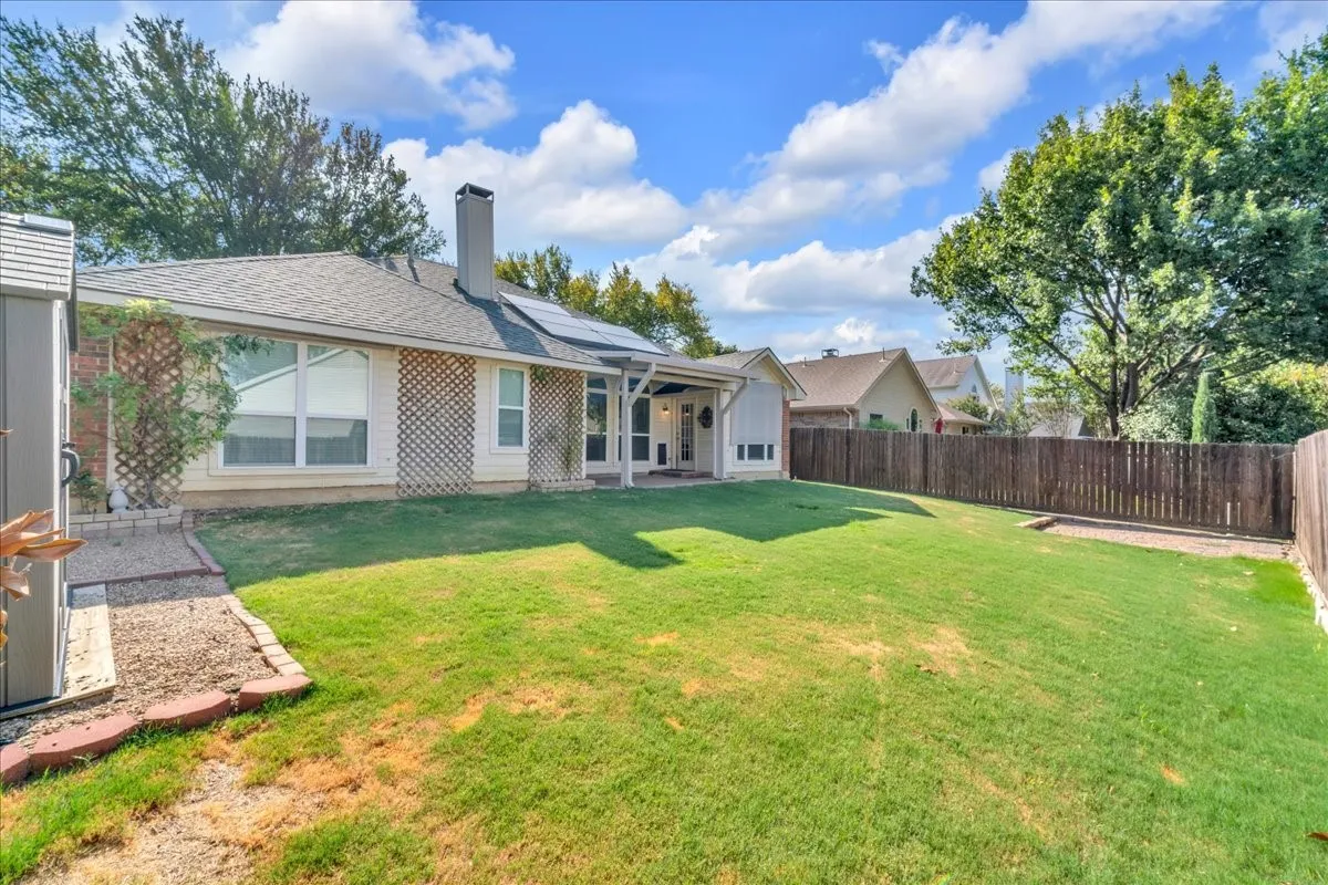 Yard with picnic area in the corner.