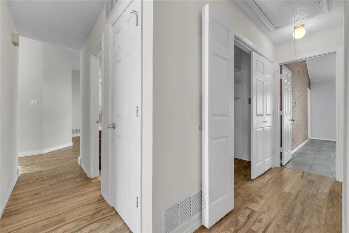 Hall with guest bathroom and laundry closet