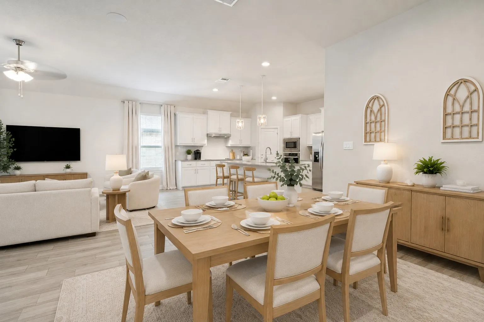 **Virtually staged for effect**Open-concept living space with wood-finish flooring, recessed lighting, and a ceiling fan