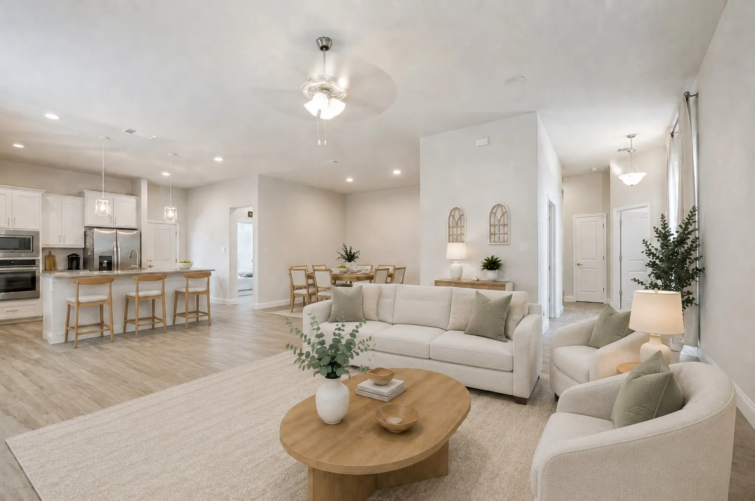**Virtually staged for effect**Open-concept living area featuring wood-finish flooring, recessed lighting, and a ceiling fan