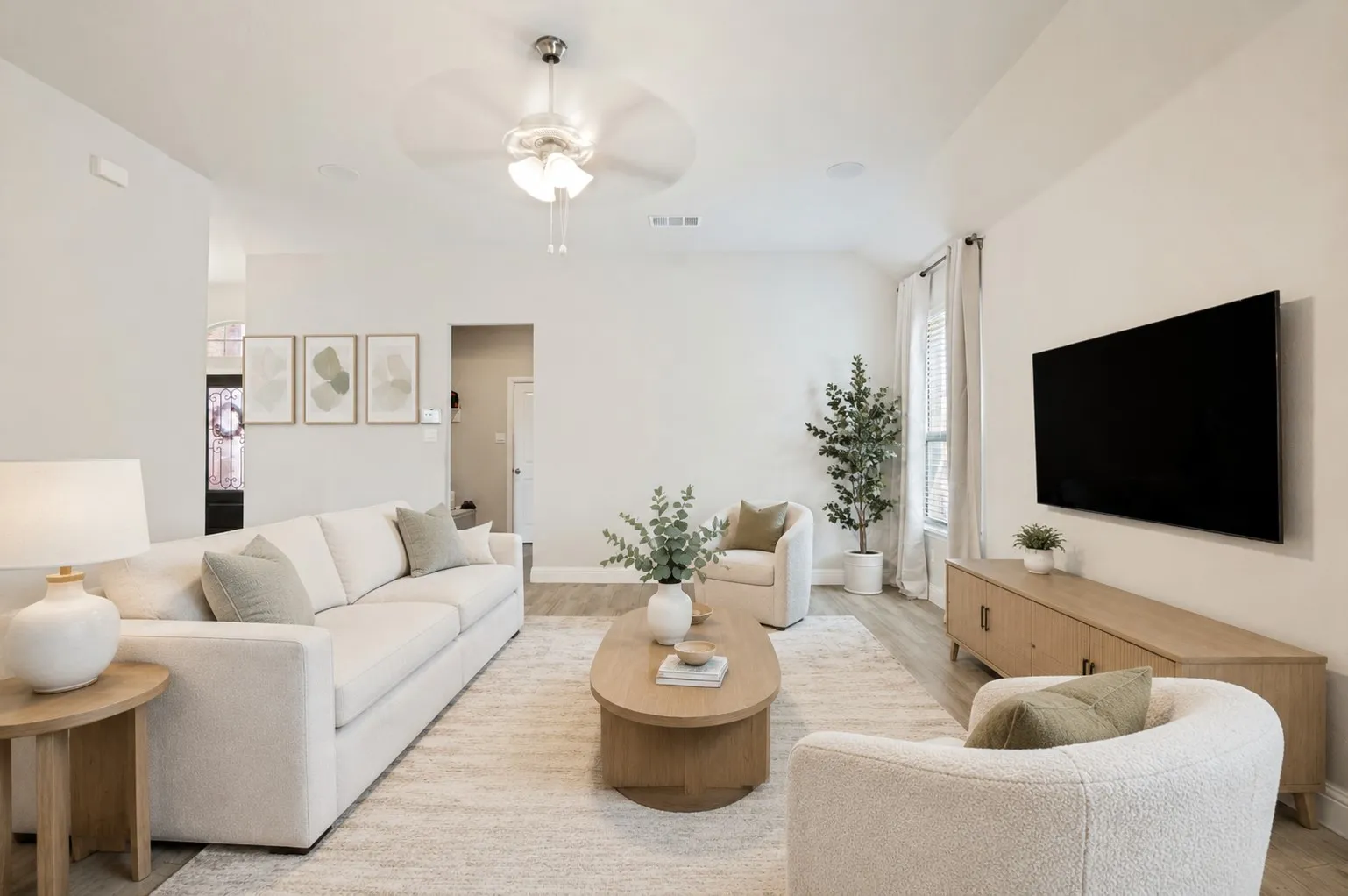 **Virtually staged for effect**High ceilings, wood-finish flooring, recessed lighting, ceiling fan, and window with vertical blinds