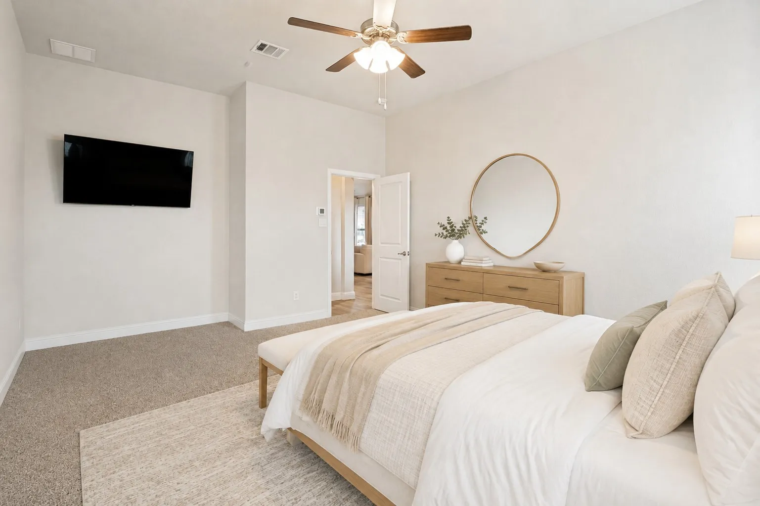 **Virtually staged for effect**Carpeted flooring, ceiling fan, white paneled door, and neutral wall tones