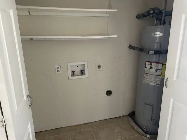 Full size washer and dryer area