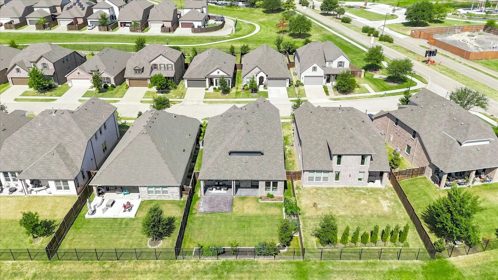 Expansive green spaces and multiple properties featuring covered patios