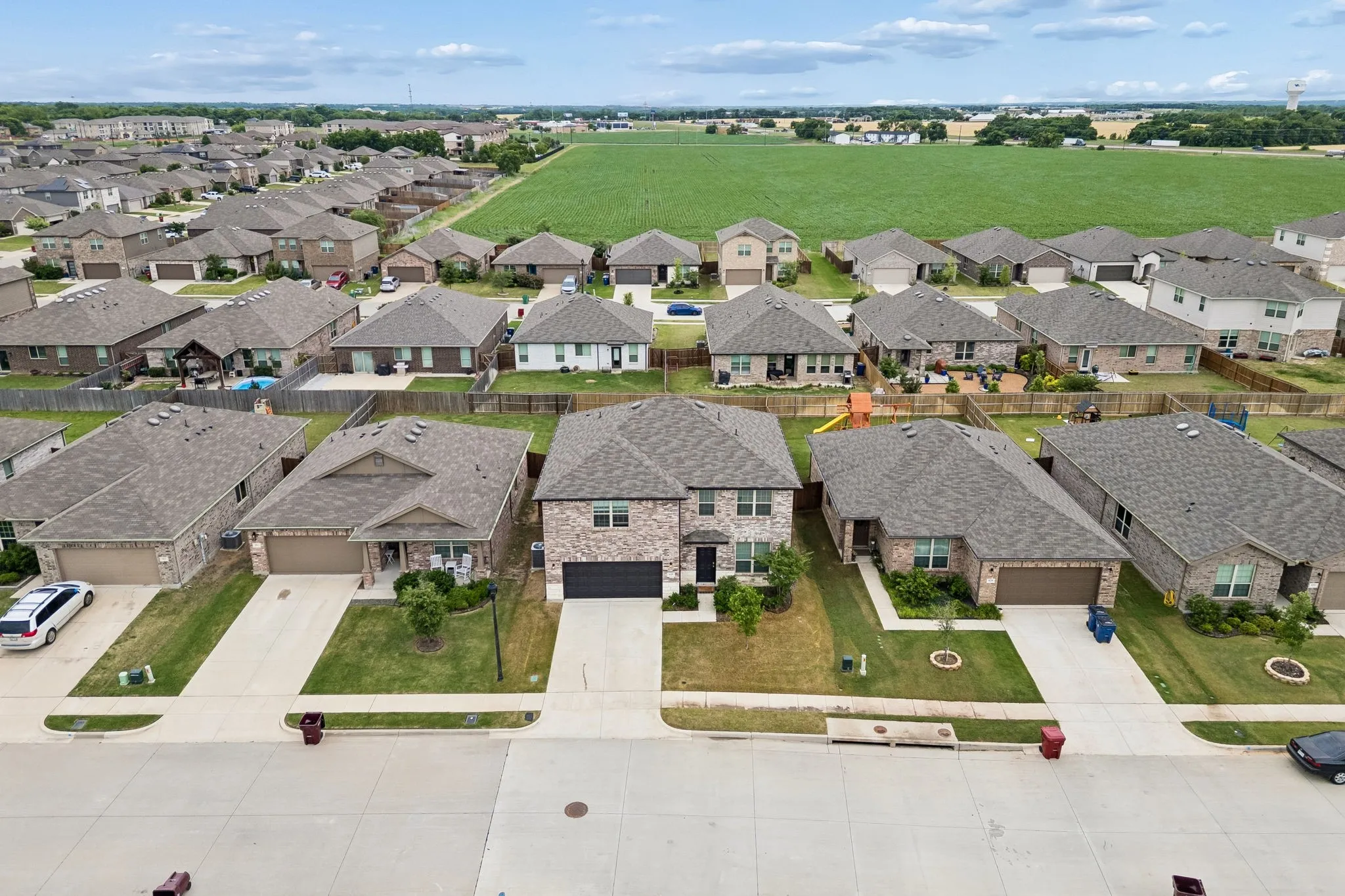 Aerial perspective of the surrounding Van Alstyne neighborhood and nearby development.