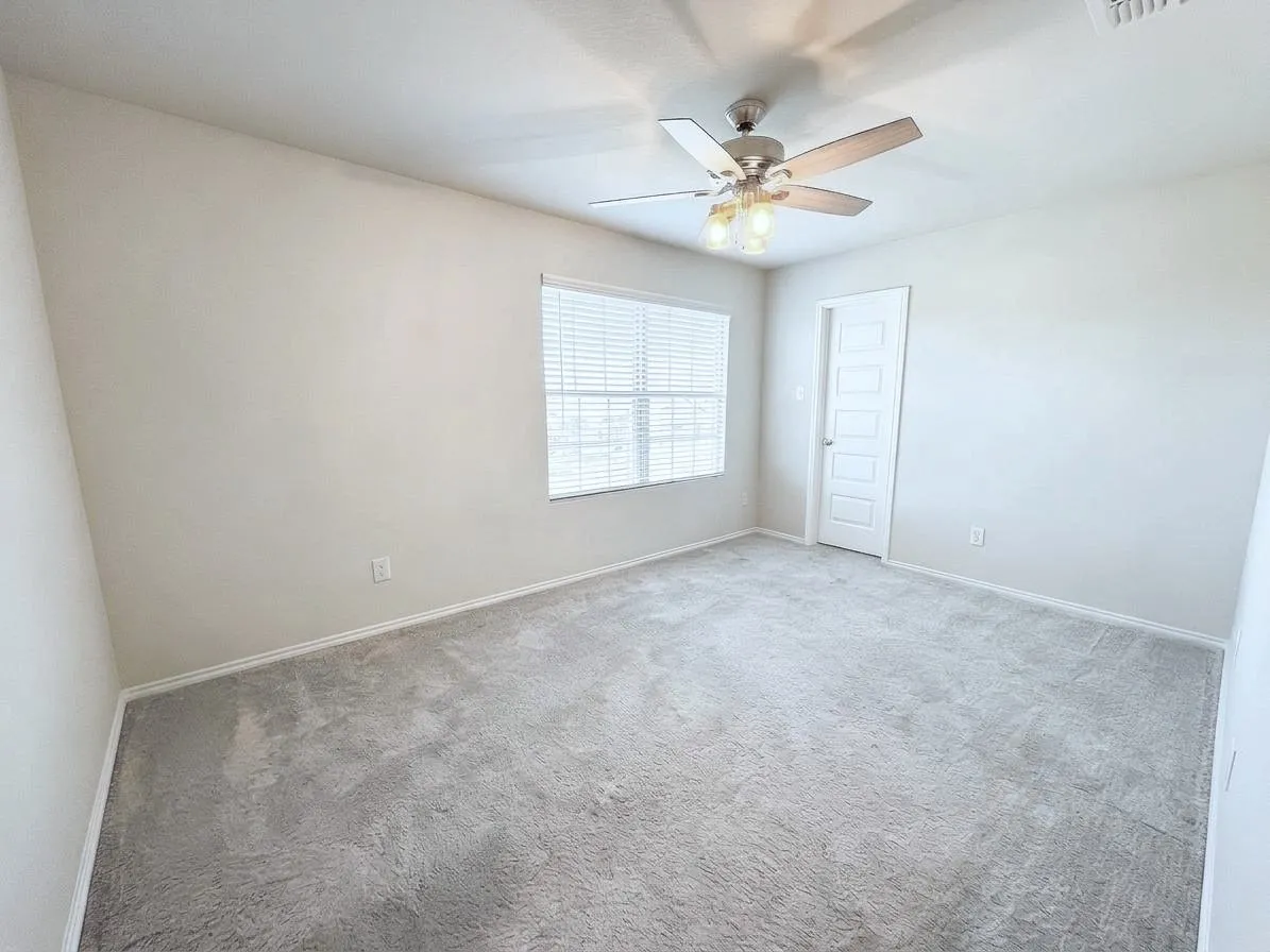 Second upstairs secondary bedroom offers comfortable space with nearby access to the full bath.