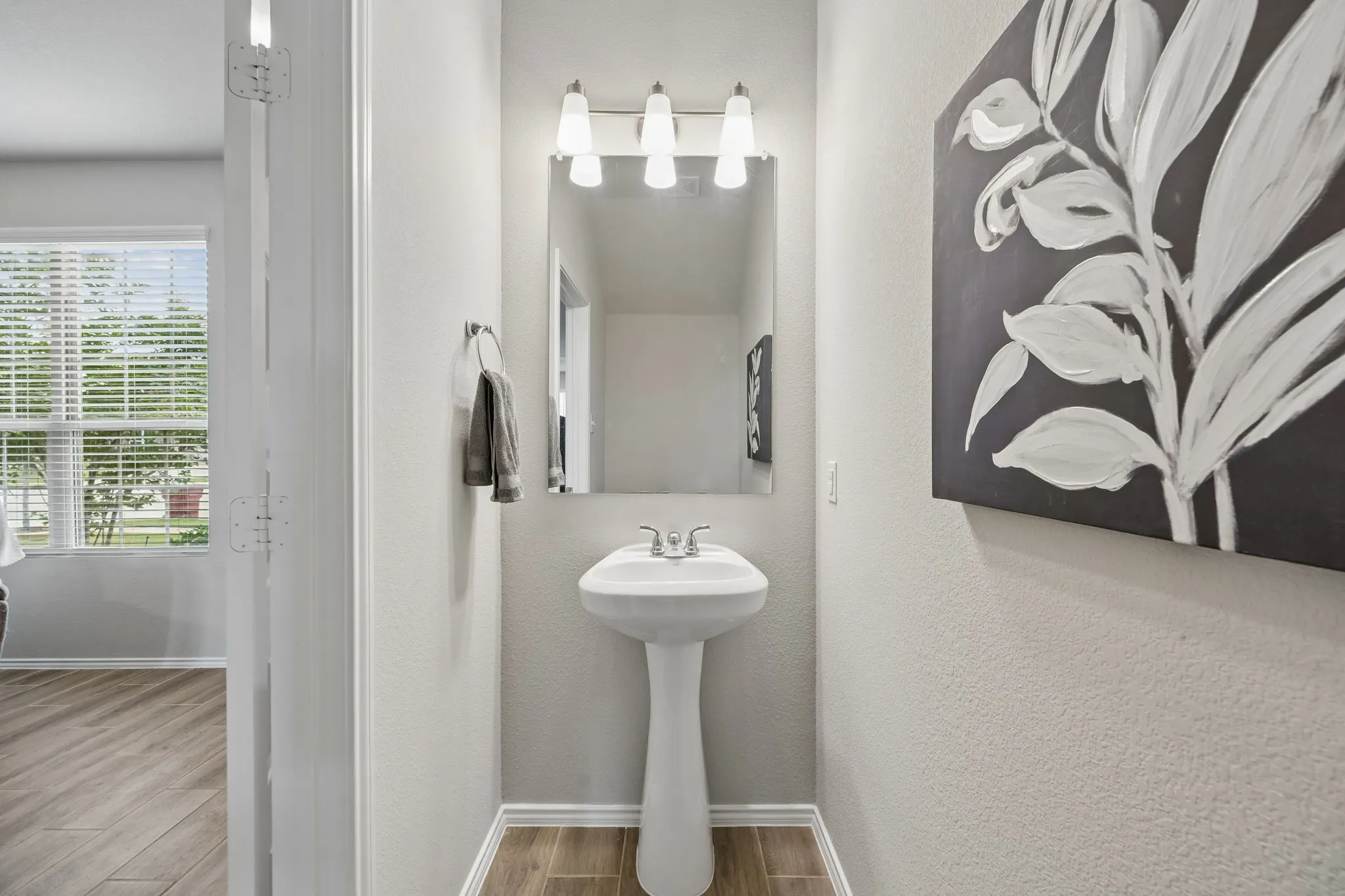Convenient half bath located downstairs.